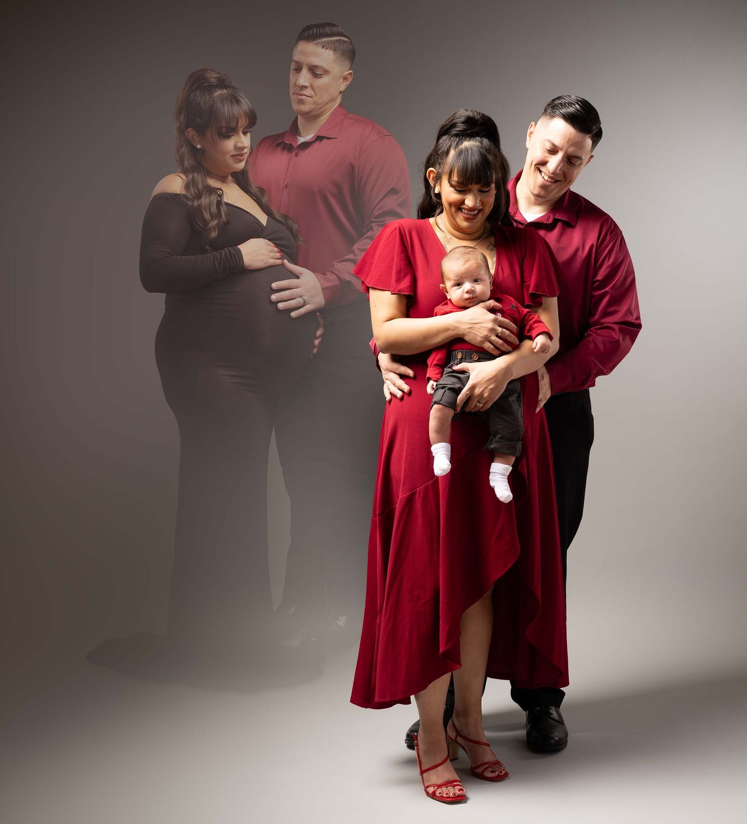 A couple in red outfits holding a newborn baby, with a ghosted pregnancy photo in the background.