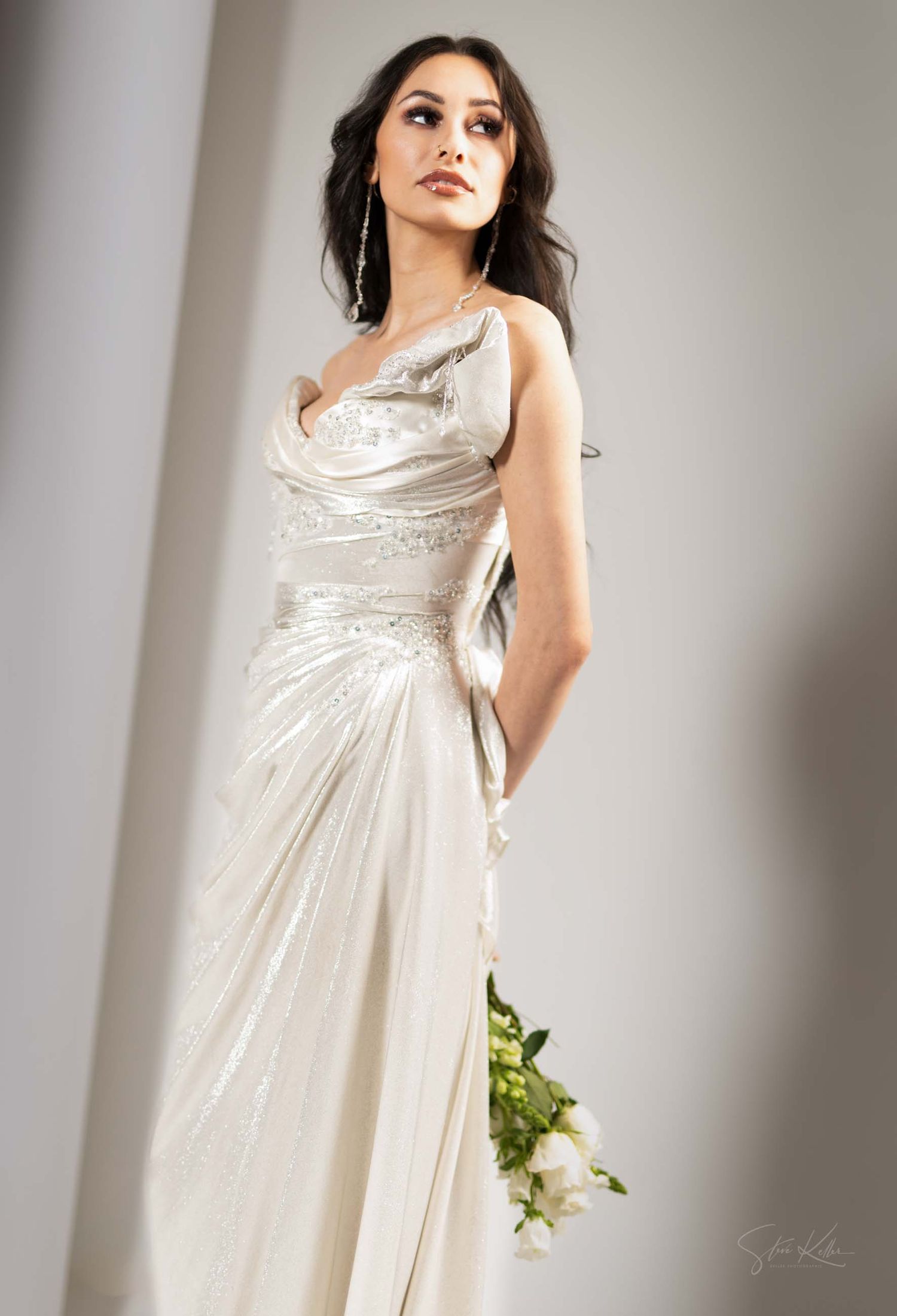 A flowing white empire waist dress with gathered bodice details shown from multiple angles in a fashion photoshoot.