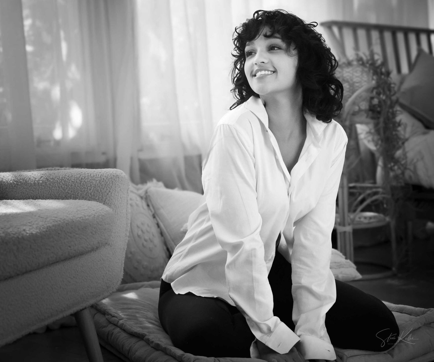 A series of black and white photographs showing someone in a white shirt lounging on furniture in soft natural light.