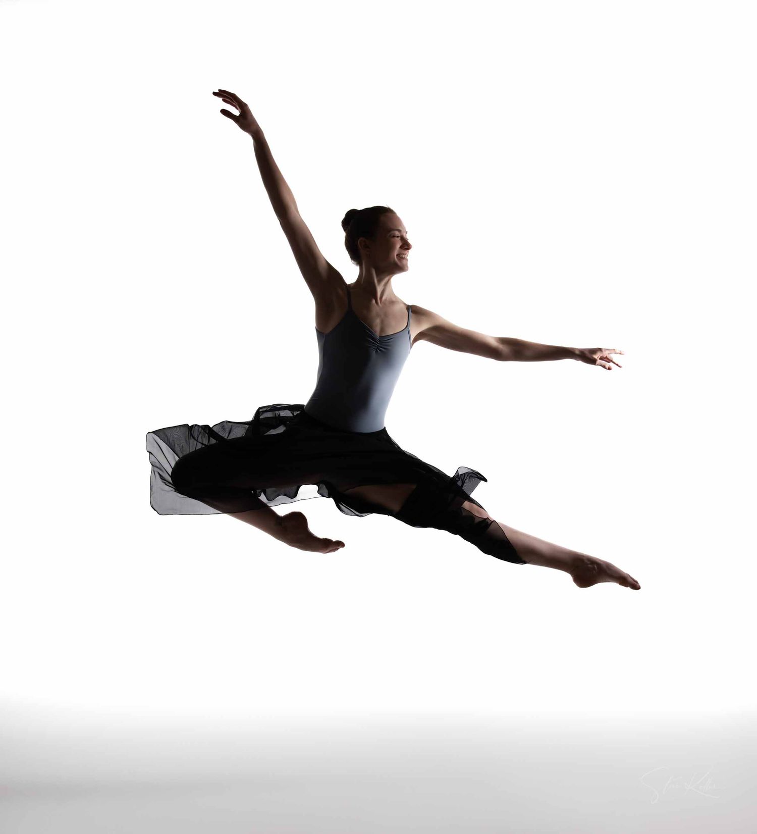Dynamic dance sequence showing silhouetted figure executing aerial movements and jumps on white backdrop.