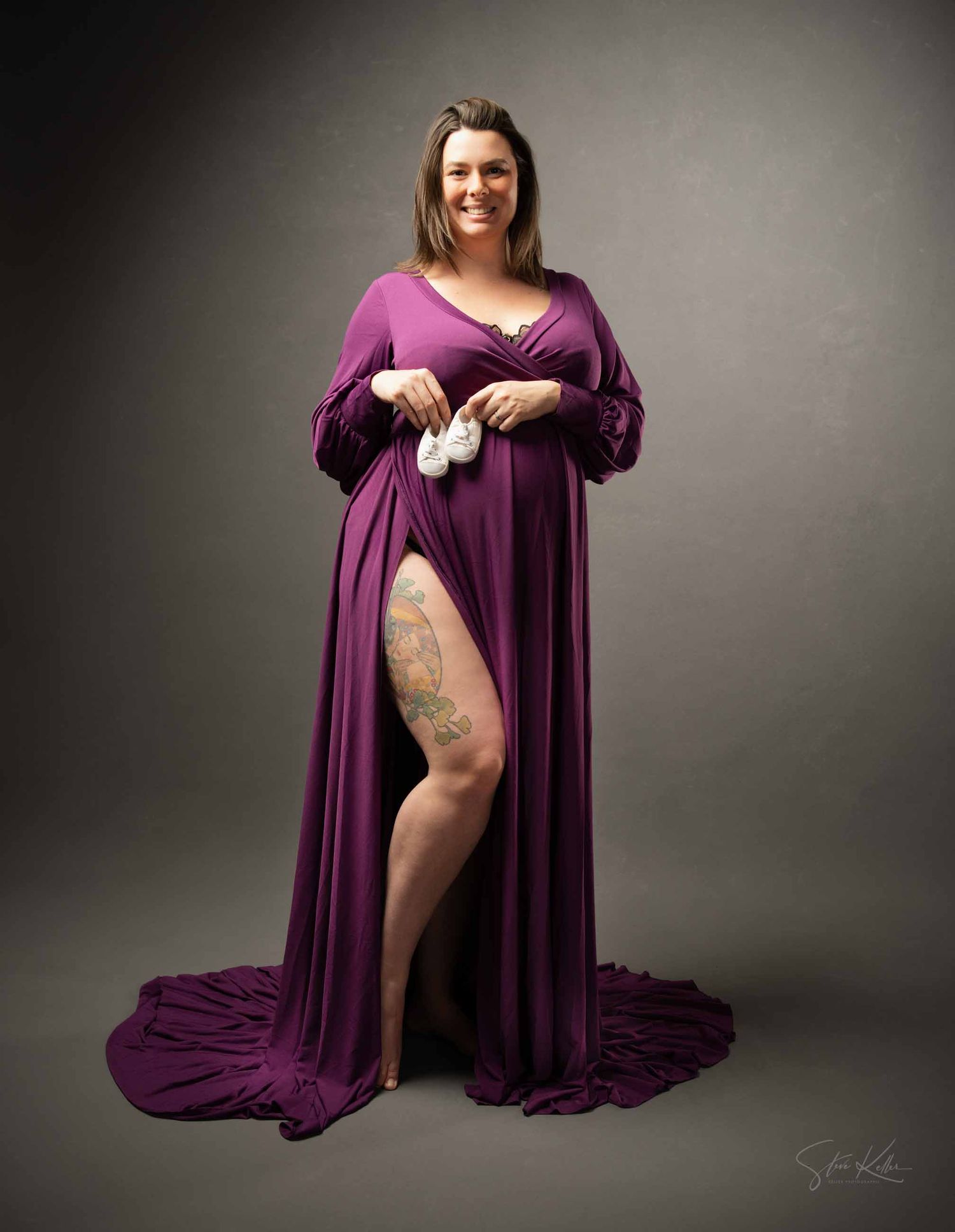 A series of artistic boudoir photos showing someone in a flowing purple dress against a dark studio backdrop.