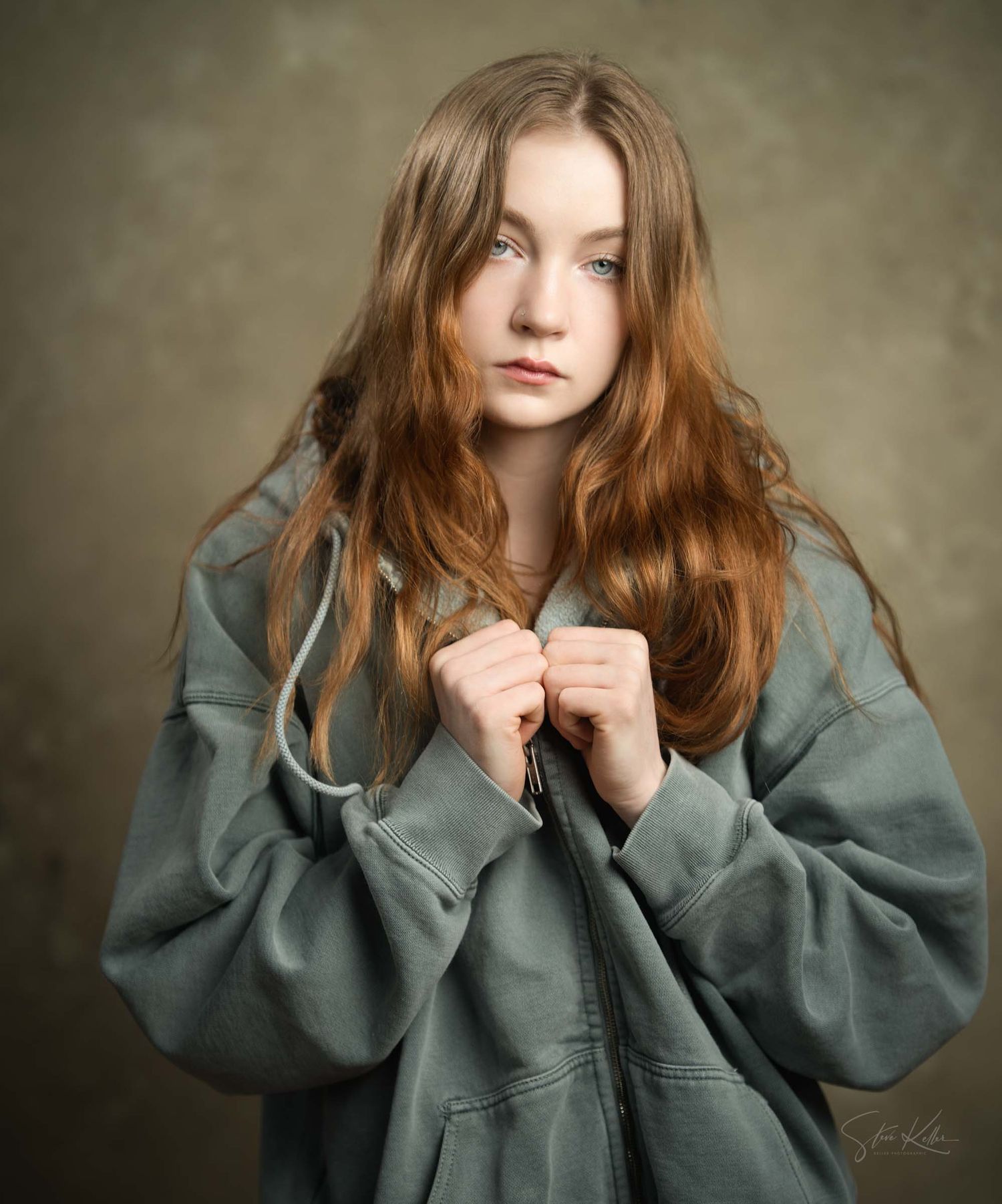 Artistic portrait sequence featuring model in oversized grey jacket with moody lighting.