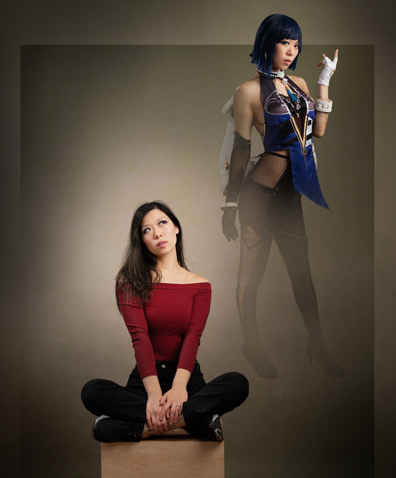 A figure in a blue blazer and red sweater strikes various poses against a dark studio backdrop during a fashion photoshoot.