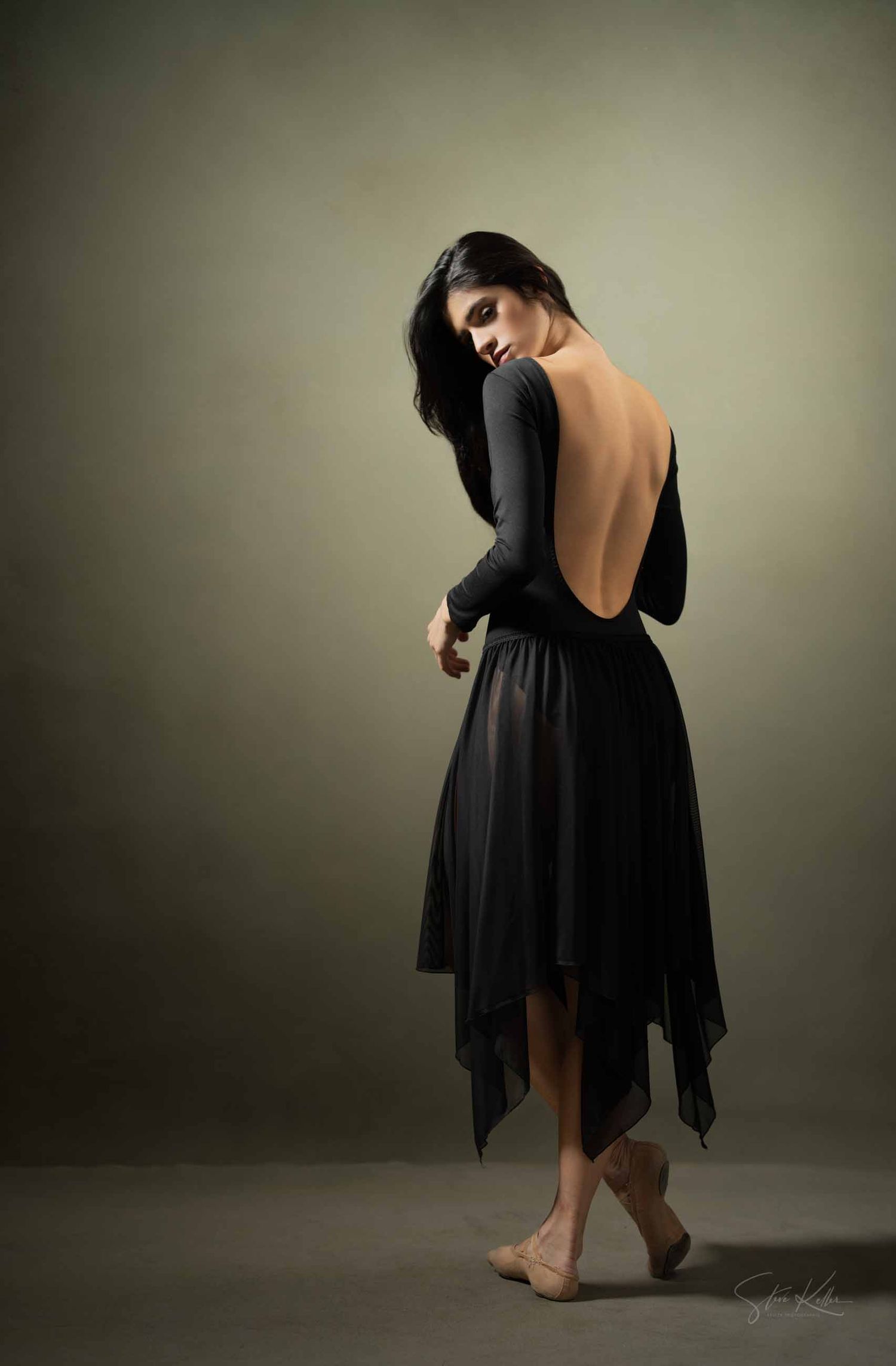 A series of artistic dance poses in a flowing black dress showing elegant movement sequences against a moody background.