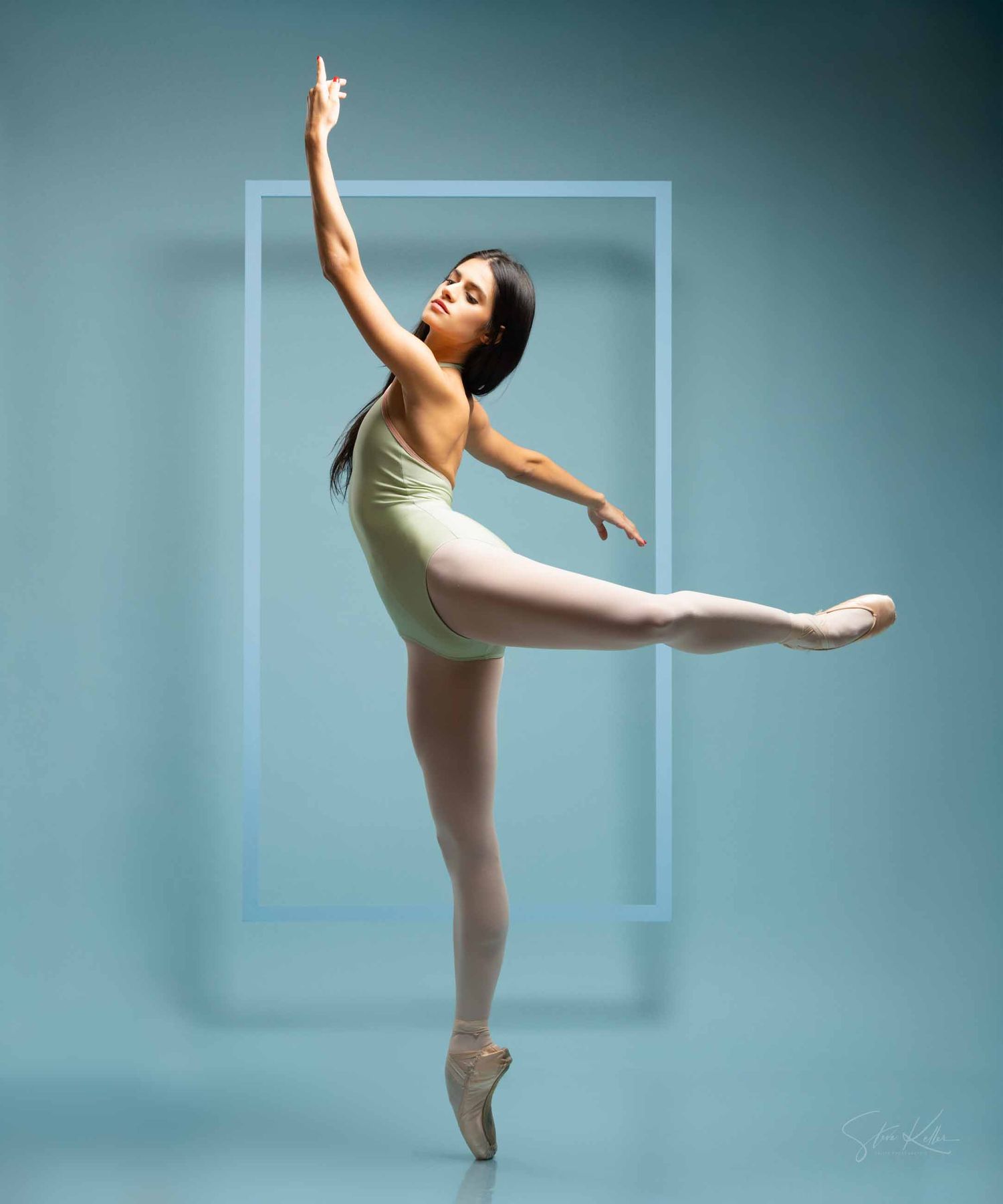 Ballet dancer in beige leotard performs graceful poses against blue-tinted studio backdrop in four-part sequence.