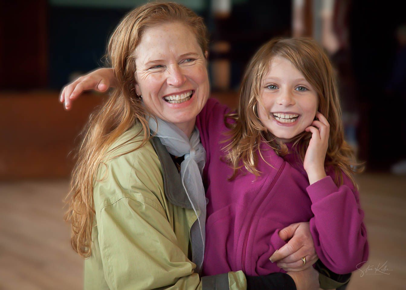 A candid series of six photos showing joyful laughter and natural expressions between two people in casual attire.