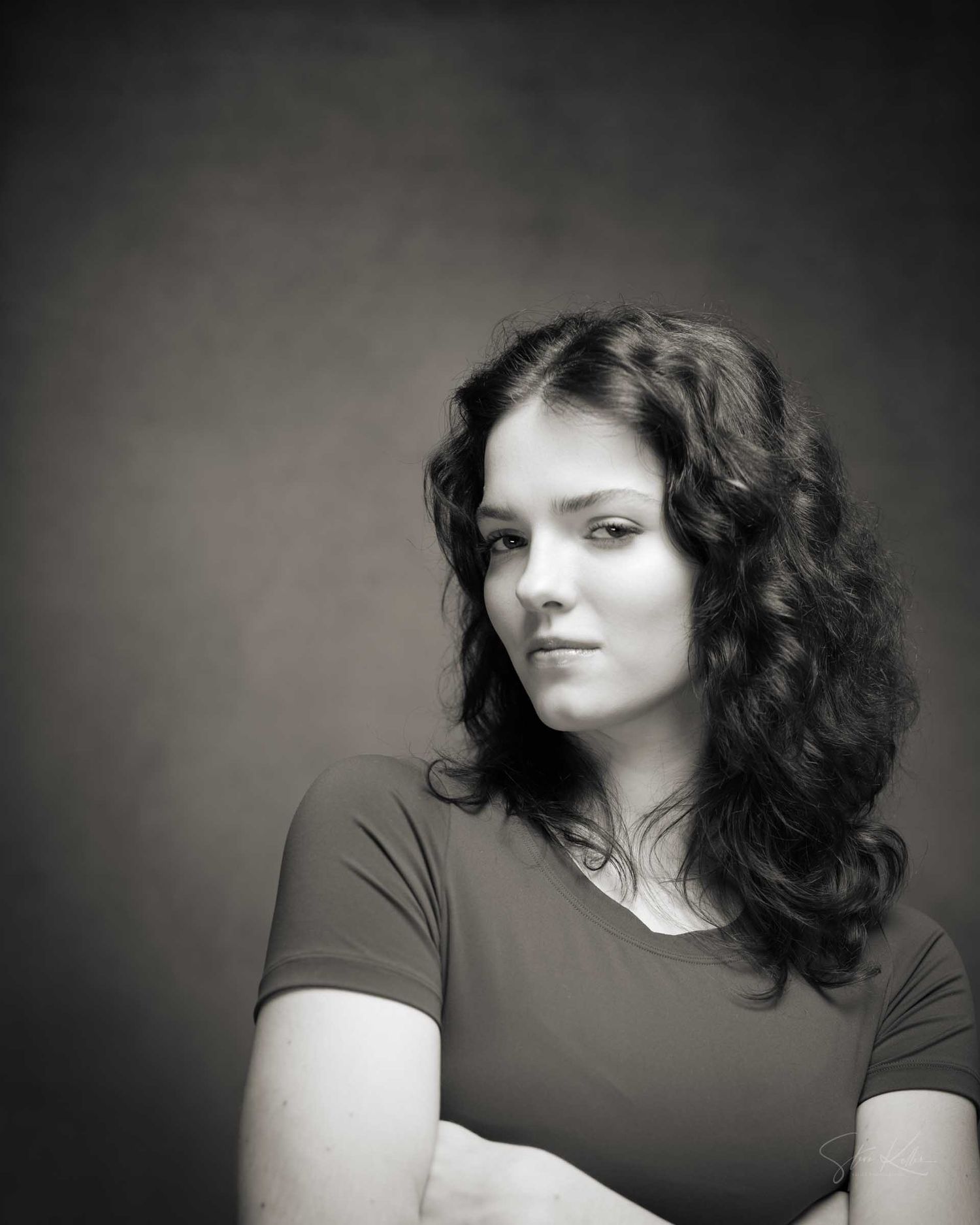 A series of dramatic black and white portraits showing movement and emotion against a dark background.