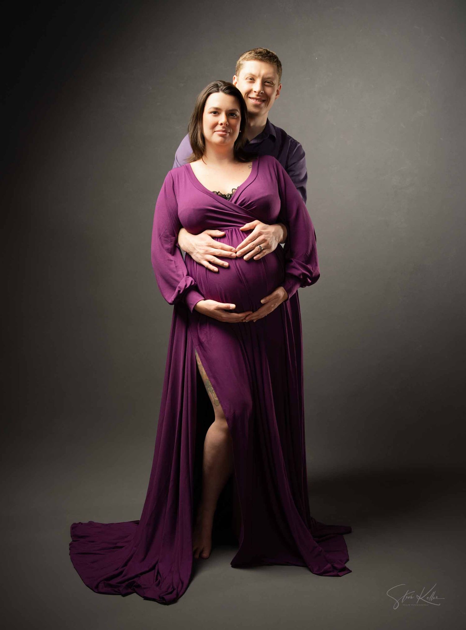 A series of maternity photos showing a couple in purple attire against a dark studio backdrop.