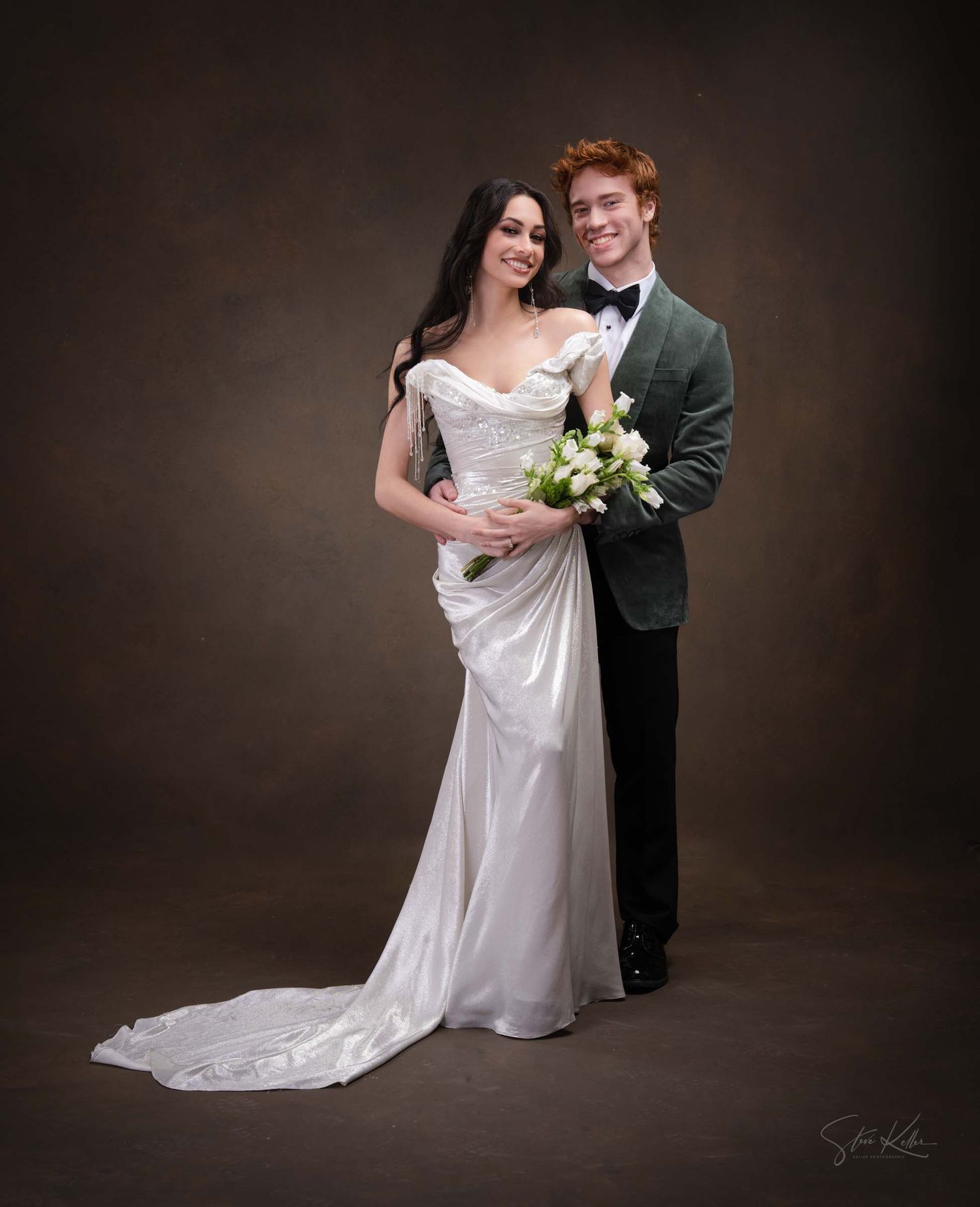 A couple in wedding attire poses together against a dark studio backdrop in a series of romantic portraits.
