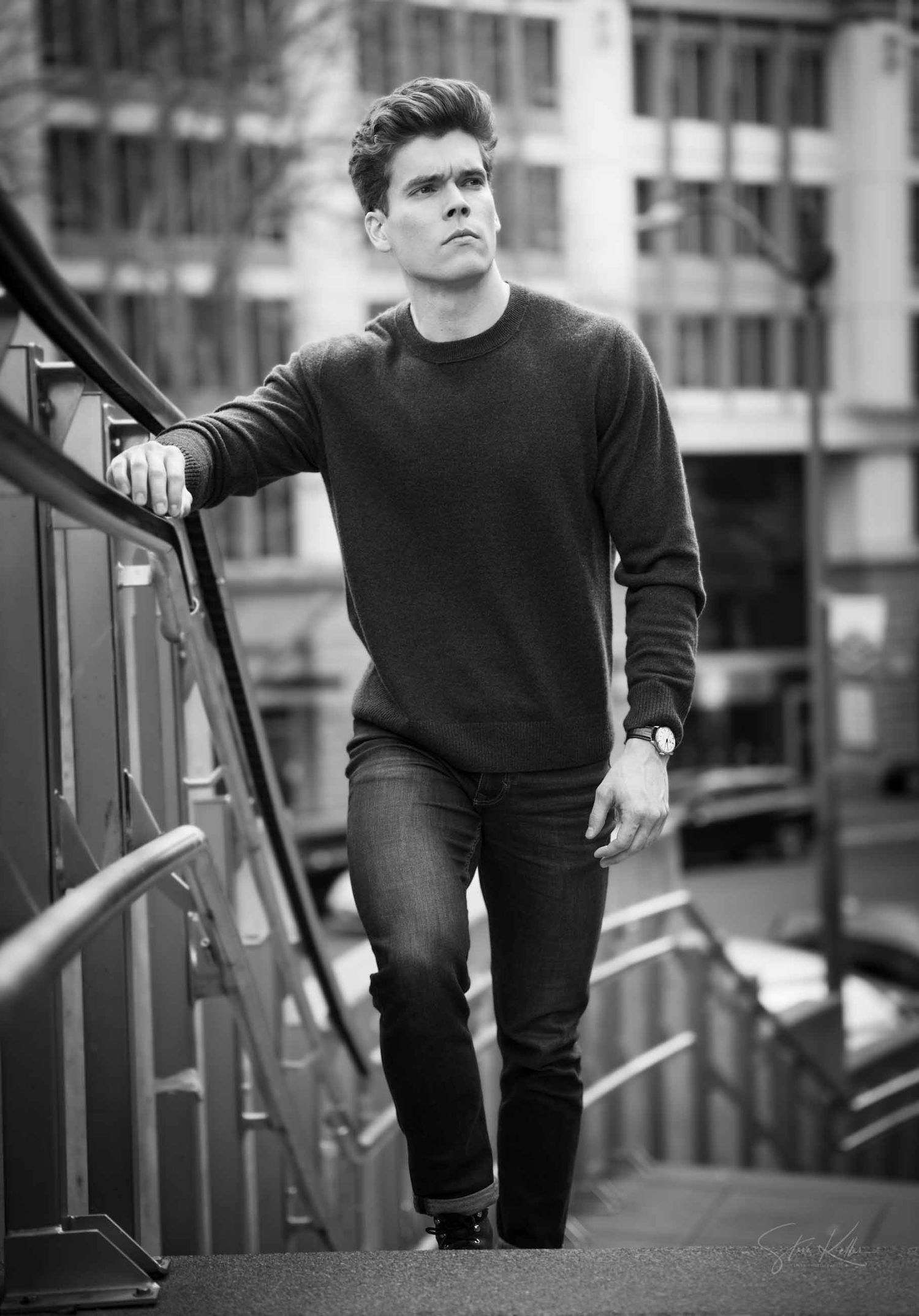 Urban fashion photo series featuring a person in dark clothing on metal stairs.