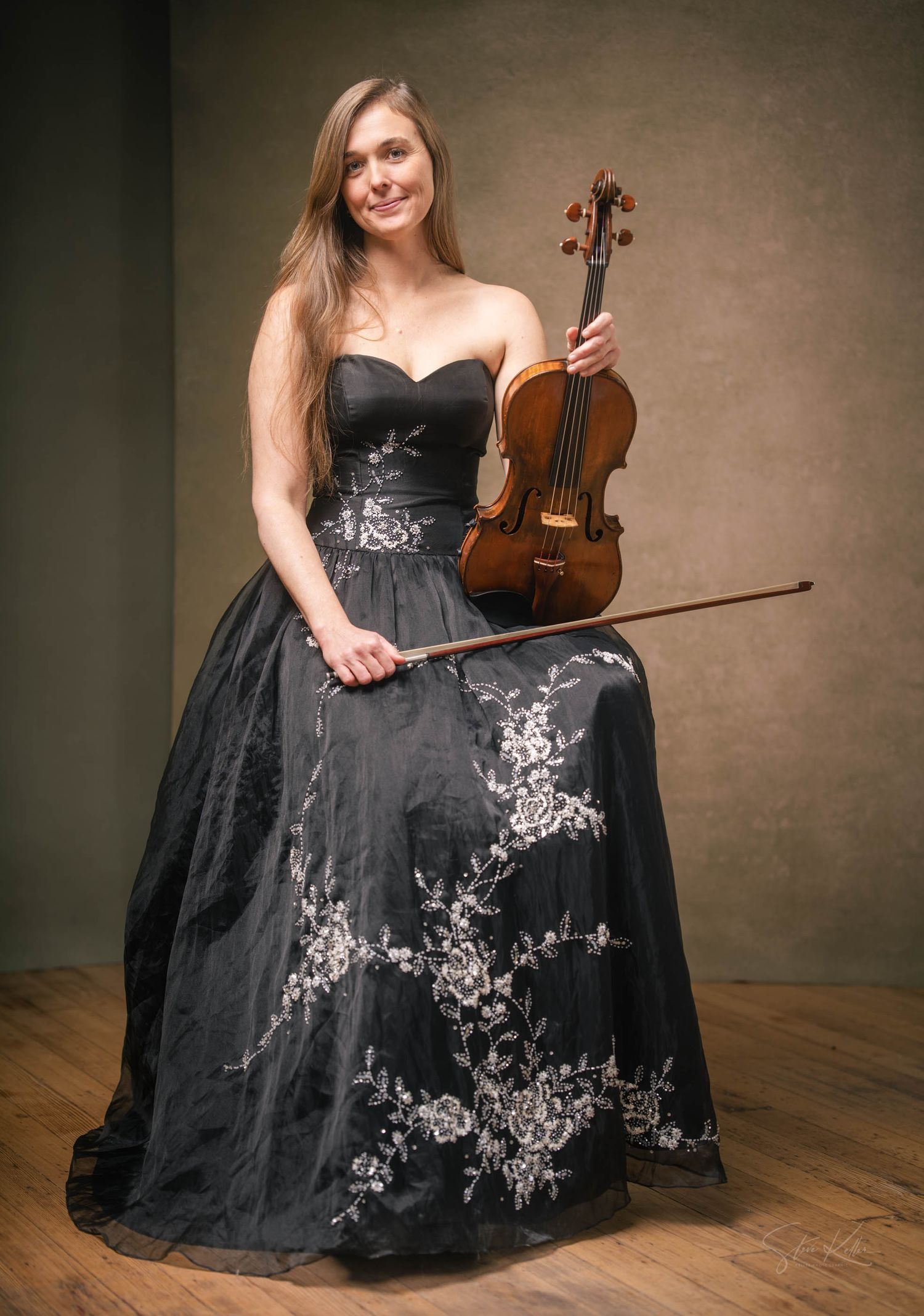 A musician in a black evening gown poses elegantly with a violin in a studio setting across multiple artistic shots.