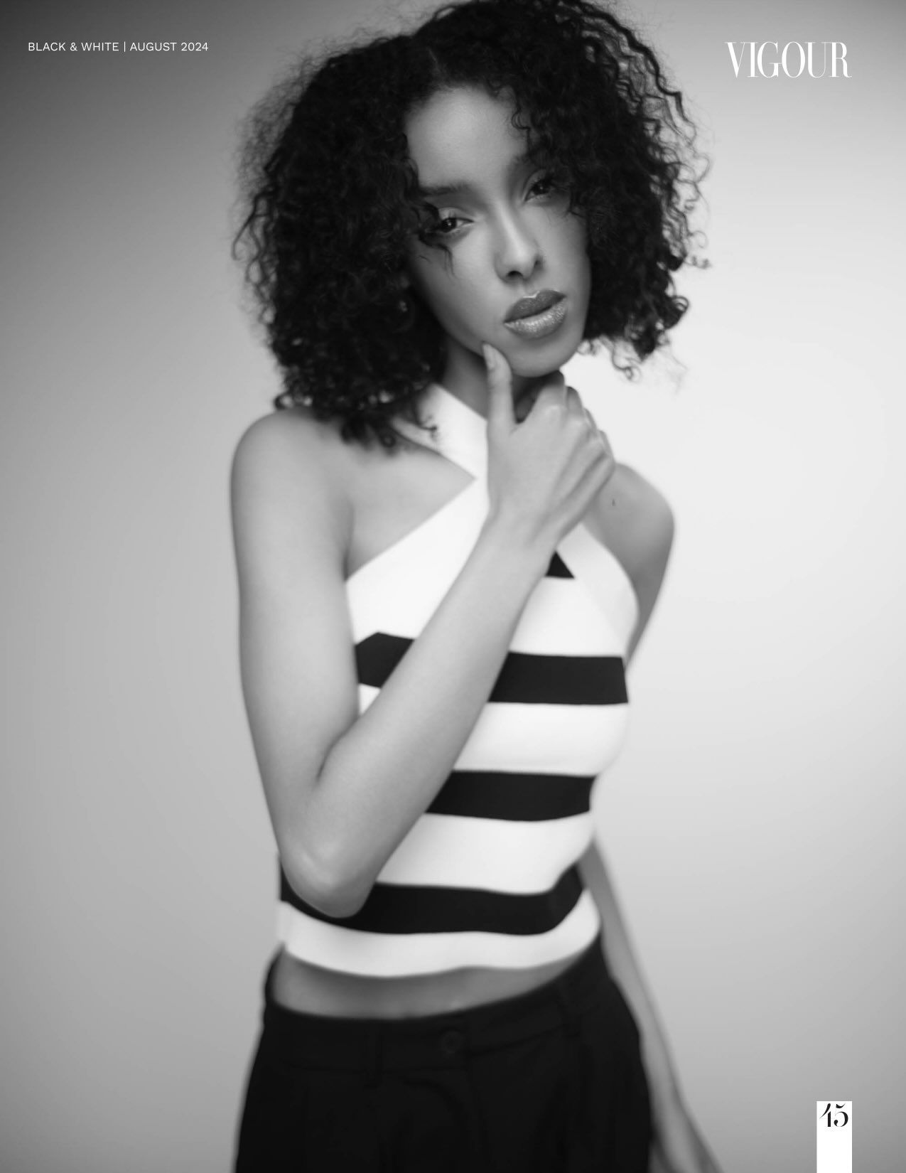 A black and white fashion photo series showing a model in contrasting white and black clothing against a simple backdrop.