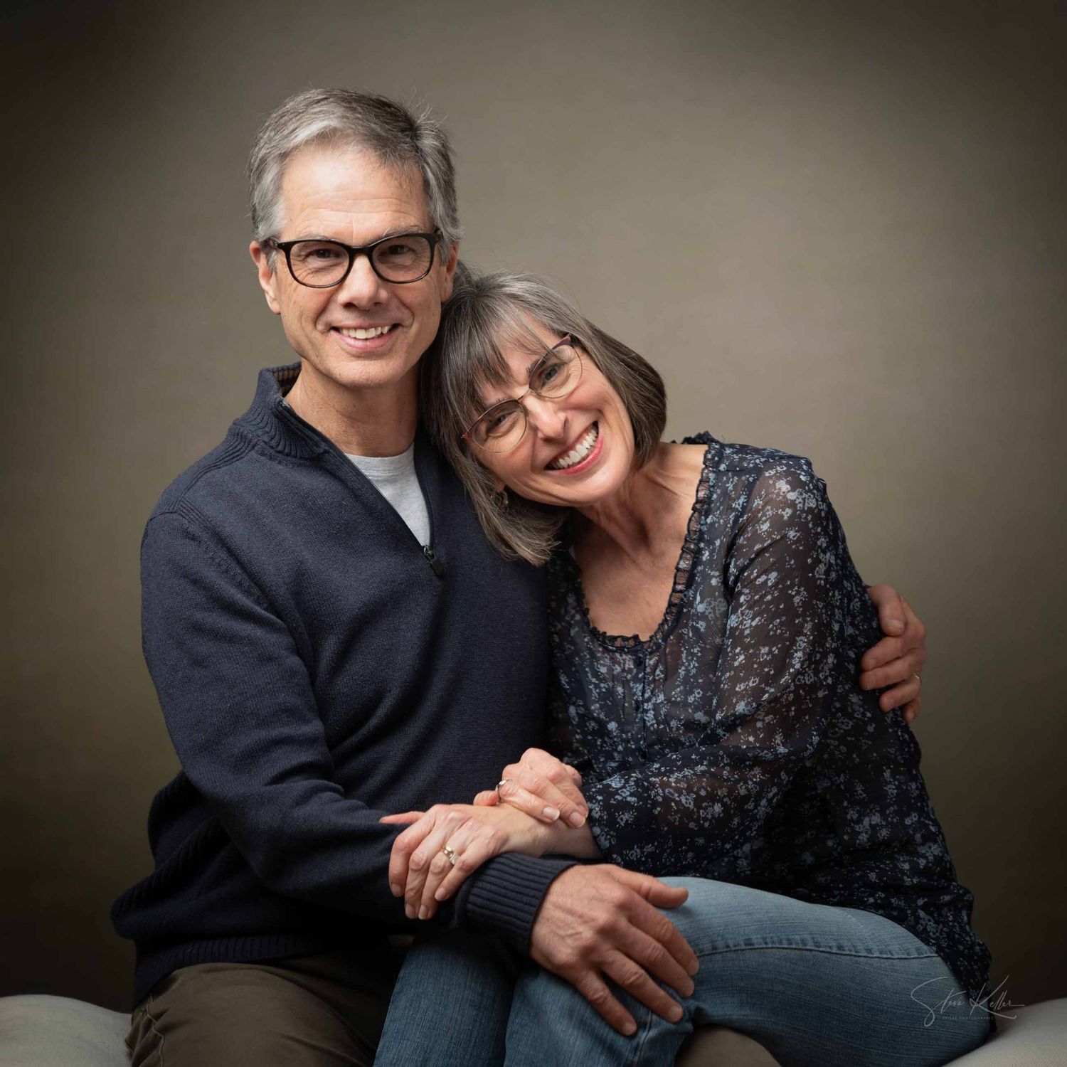 Professional studio portrait series showing couple in formal attire posing together against dark background.