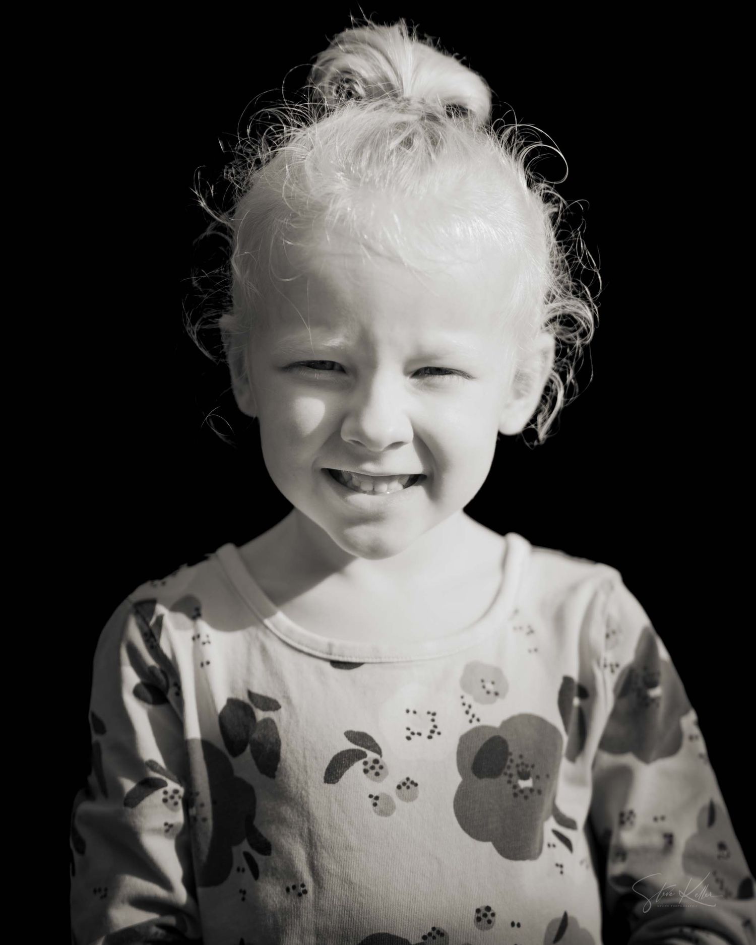 Series of black and white portraits showing joyful expressions against dark background.