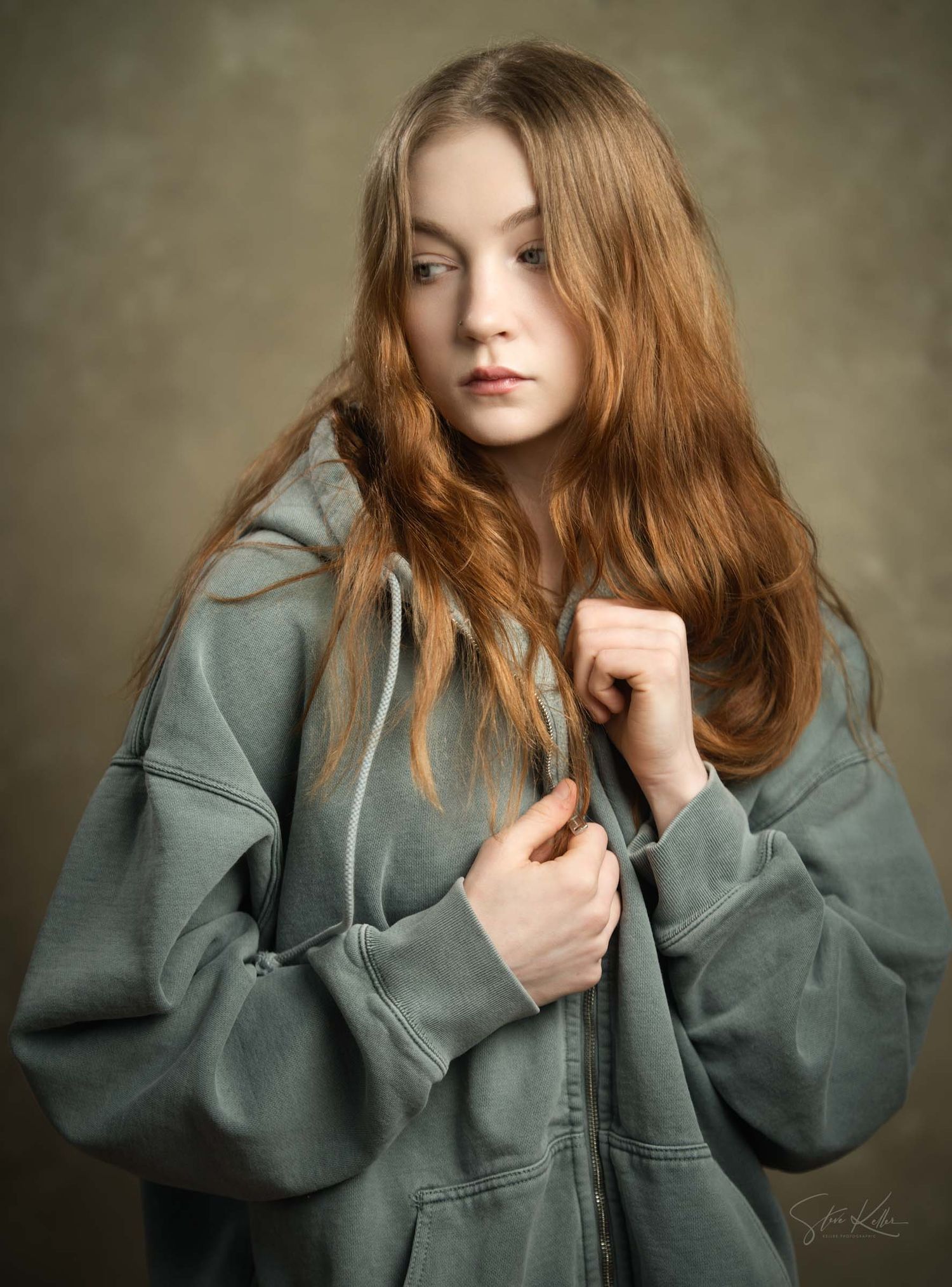 Artistic portrait series featuring a sage green oversized hoodie against a textured backdrop.