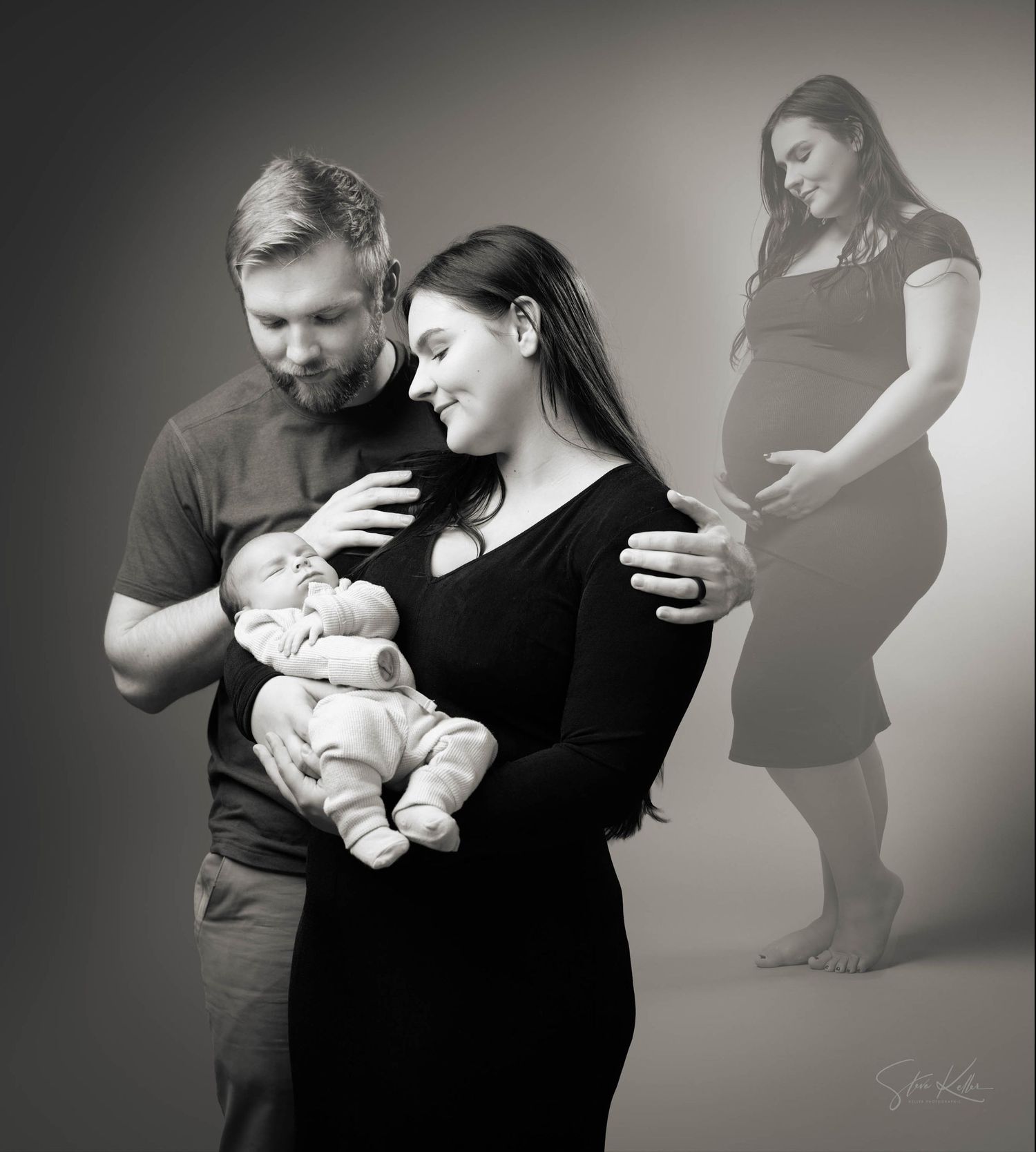 Black and white maternity photo of couple holding newborn baby, with ghosted pregnant silhouette in background.