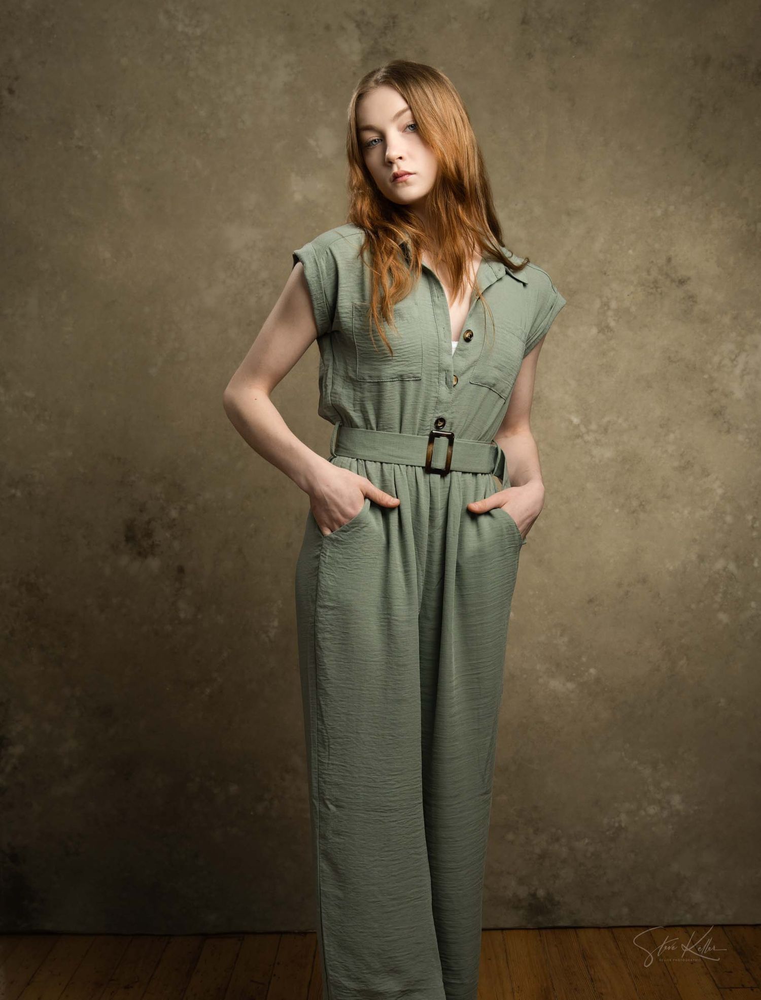 Fashion series showcasing a sage green sleeveless jumpsuit with utility pockets and belt detail.