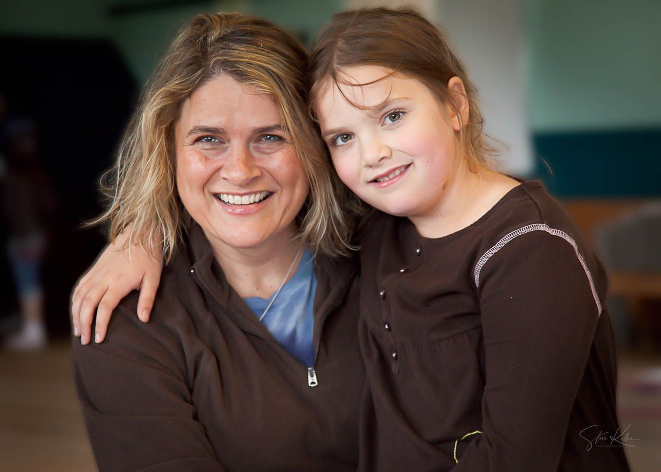 A series of candid portrait photos showing two people in brown clothing smiling together against a blurred background.