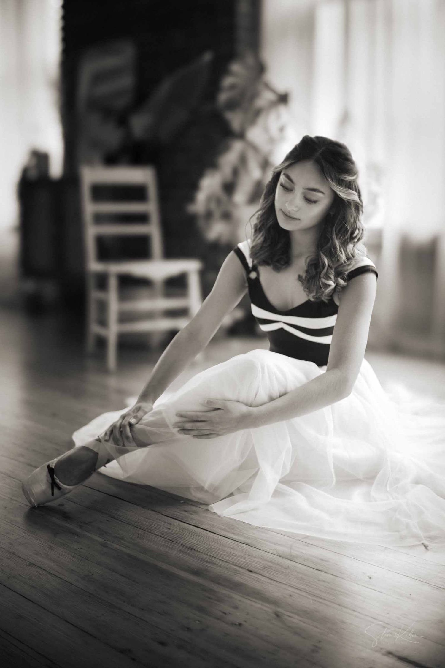 A black and white photo sequence shows a woman in white dress lying on wooden floor reading a book.