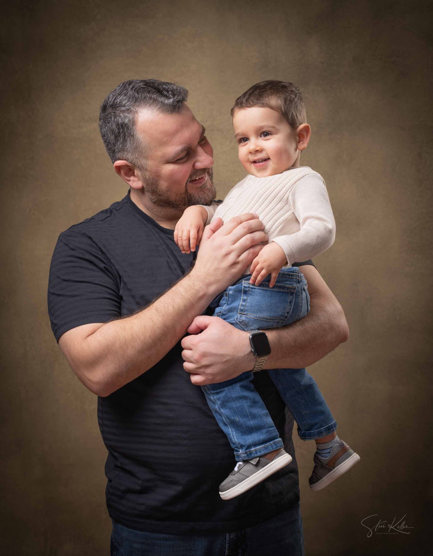 A series of playful interaction photos between an adult in a black shirt and a small child in jeans.