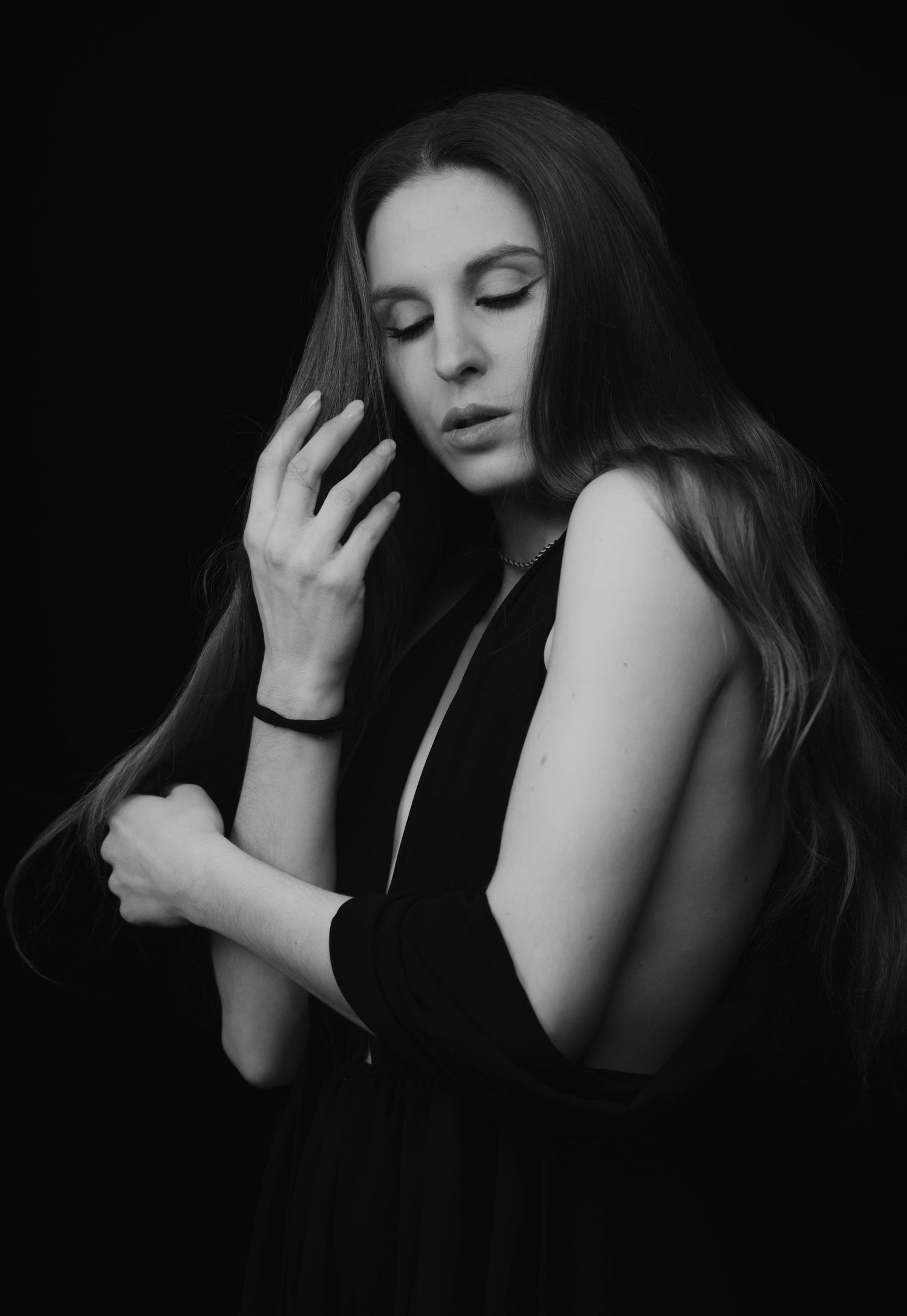 Artistic black and white portrait with dramatic poses and gestures.