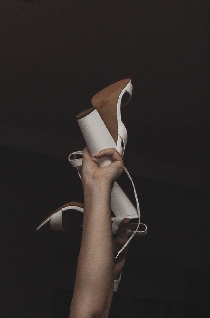 A dramatic series of photos showing a white paper being torn apart against a dark background.