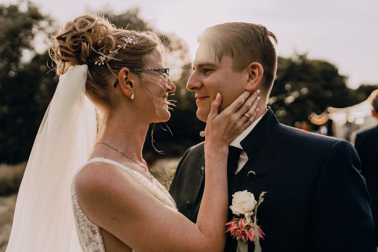 A series of intimate wedding photos showing a bride and groom embracing in romantic outdoor settings at sunset.