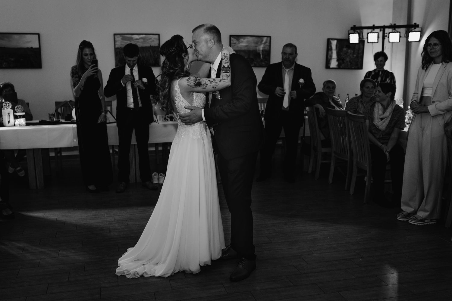 A series of wedding moments showing couples dancing in formal attire at an elegant indoor reception venue.