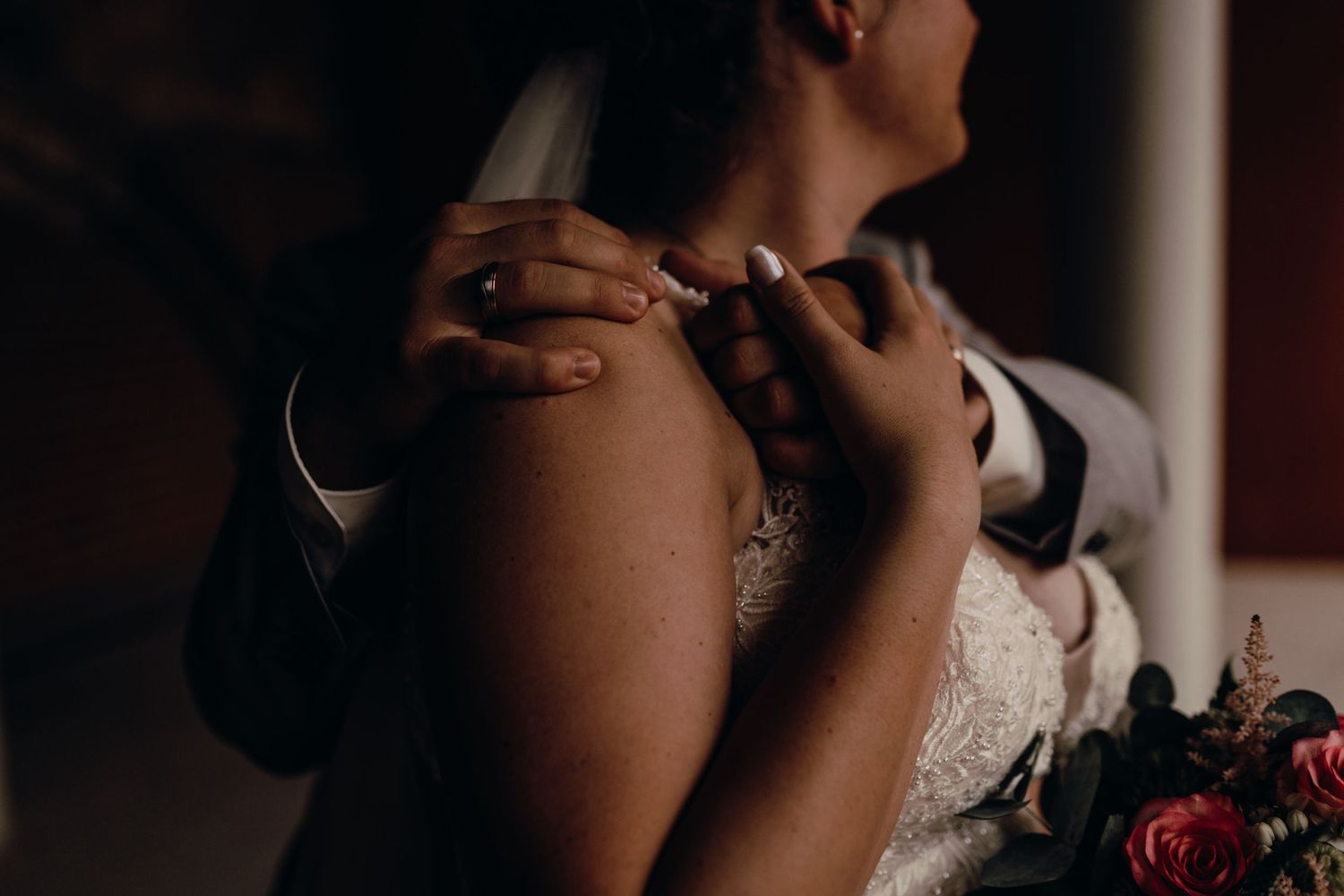 Wedding dance reflected in elegant mirrors with dramatic lighting and romantic atmosphere.
