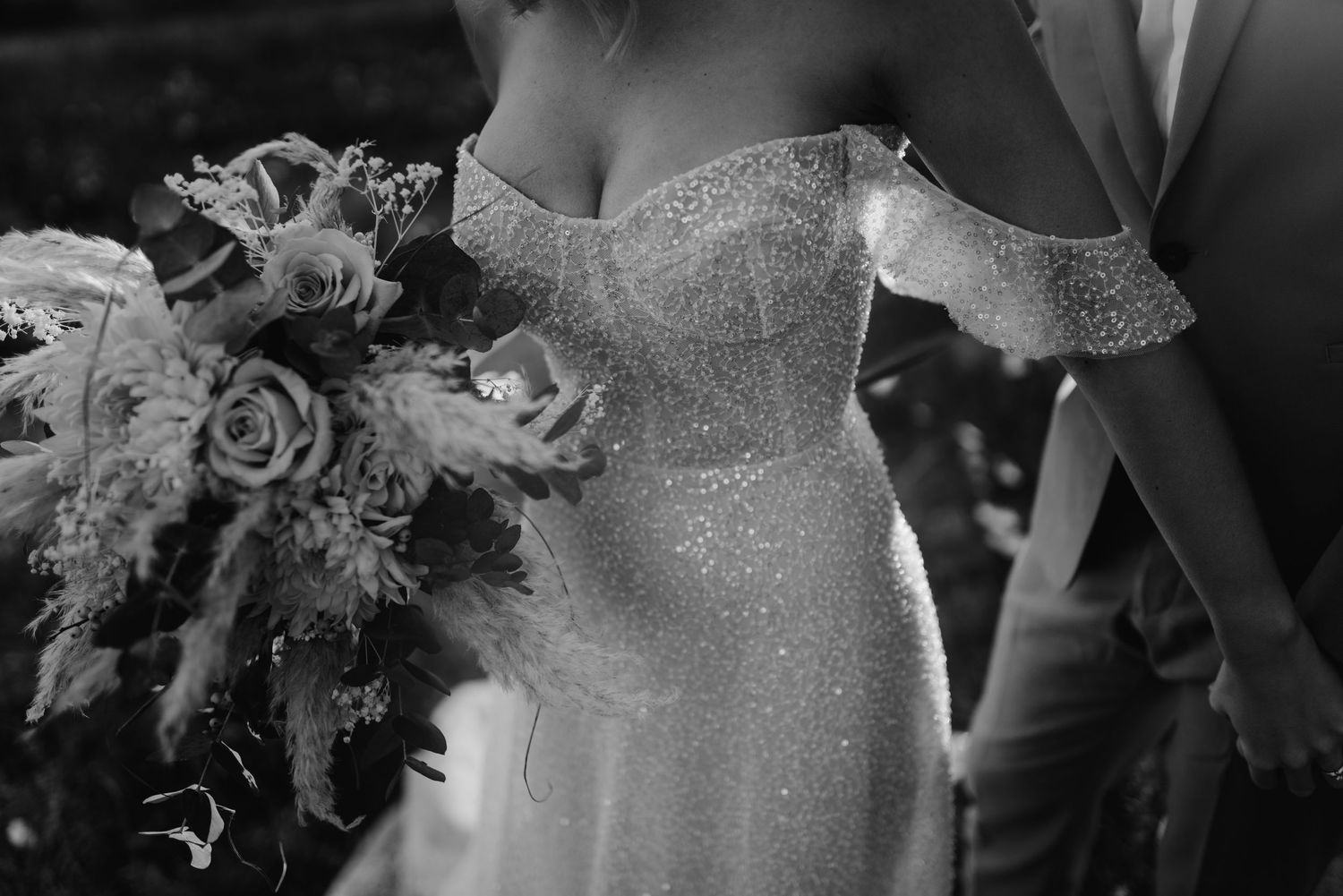 Elegant wedding and floral design elements including lace bridal gown details, bouquets, and table decorations.