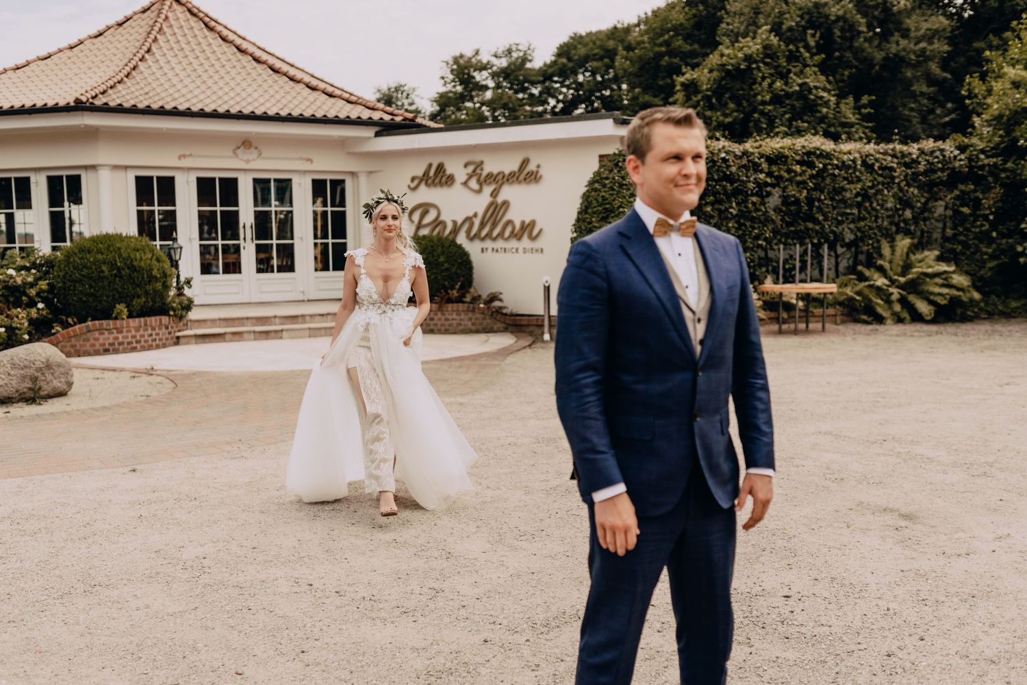 Wedding ceremony setup outdoors at an elegant estate venue with expansive grounds.