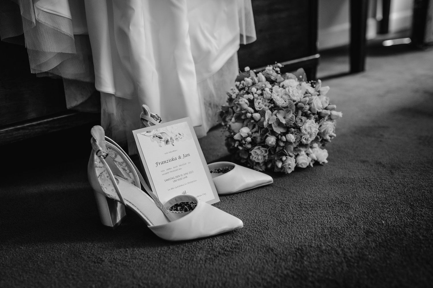 Wedding ceremony details with elegant white shoes and floral arrangements shown in a black and white collage.