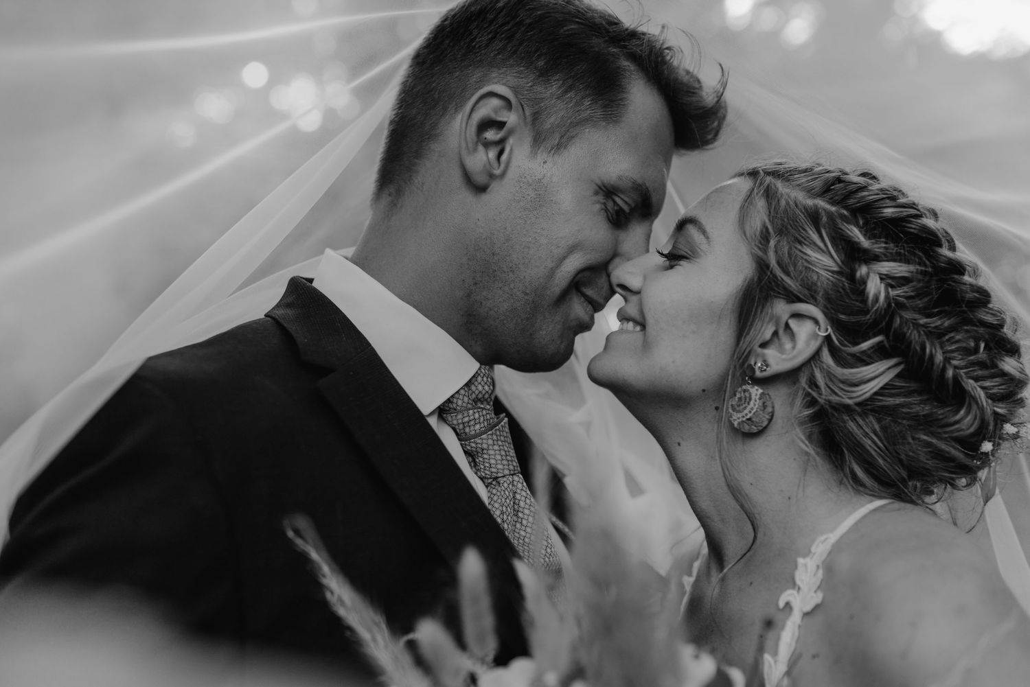 A romantic series of black and white photos showing a couple sharing intimate moments during their wedding celebration.