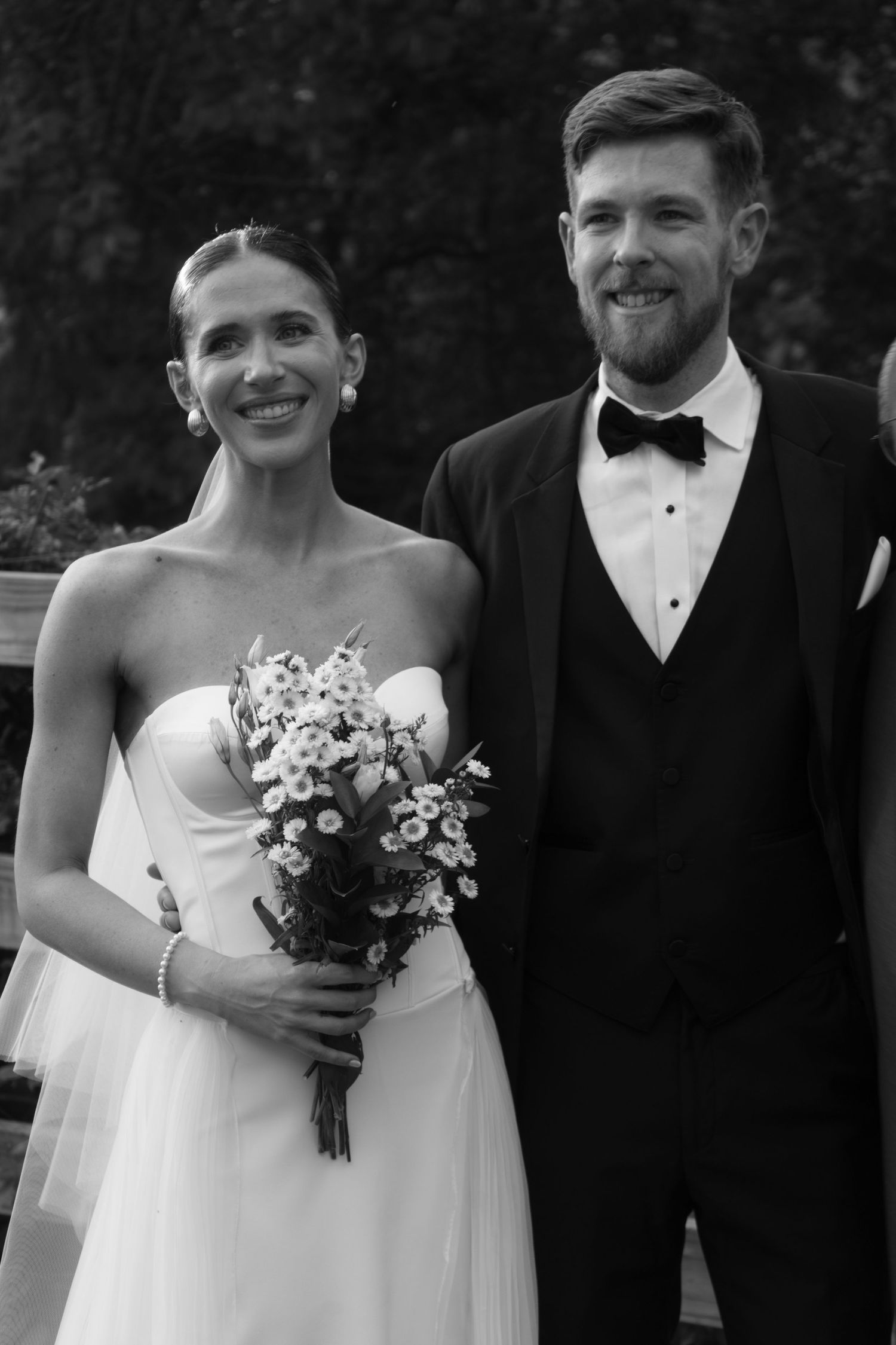 candid black and white photo of bride and groom