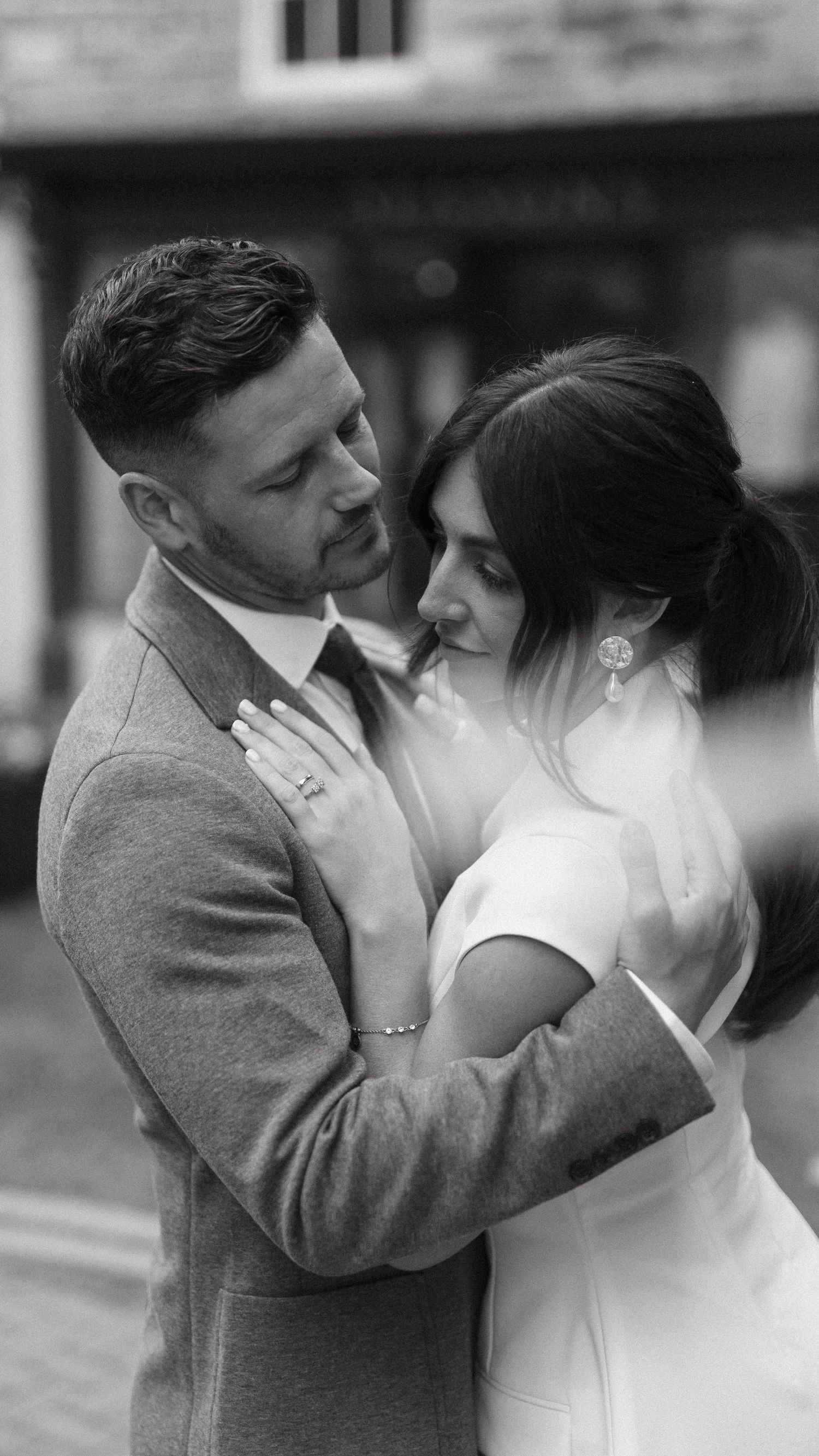 Black and white photos showing intimate moments between a couple in formal attire.