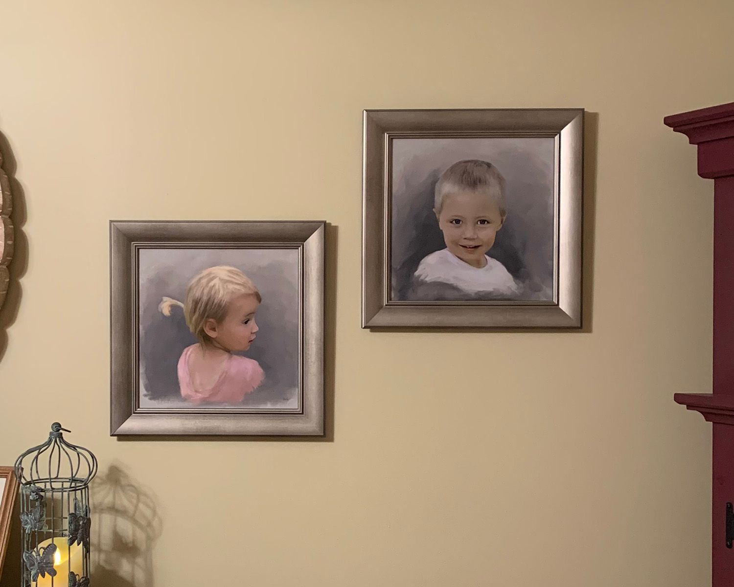 Two framed portrait painting displayed in a client home.