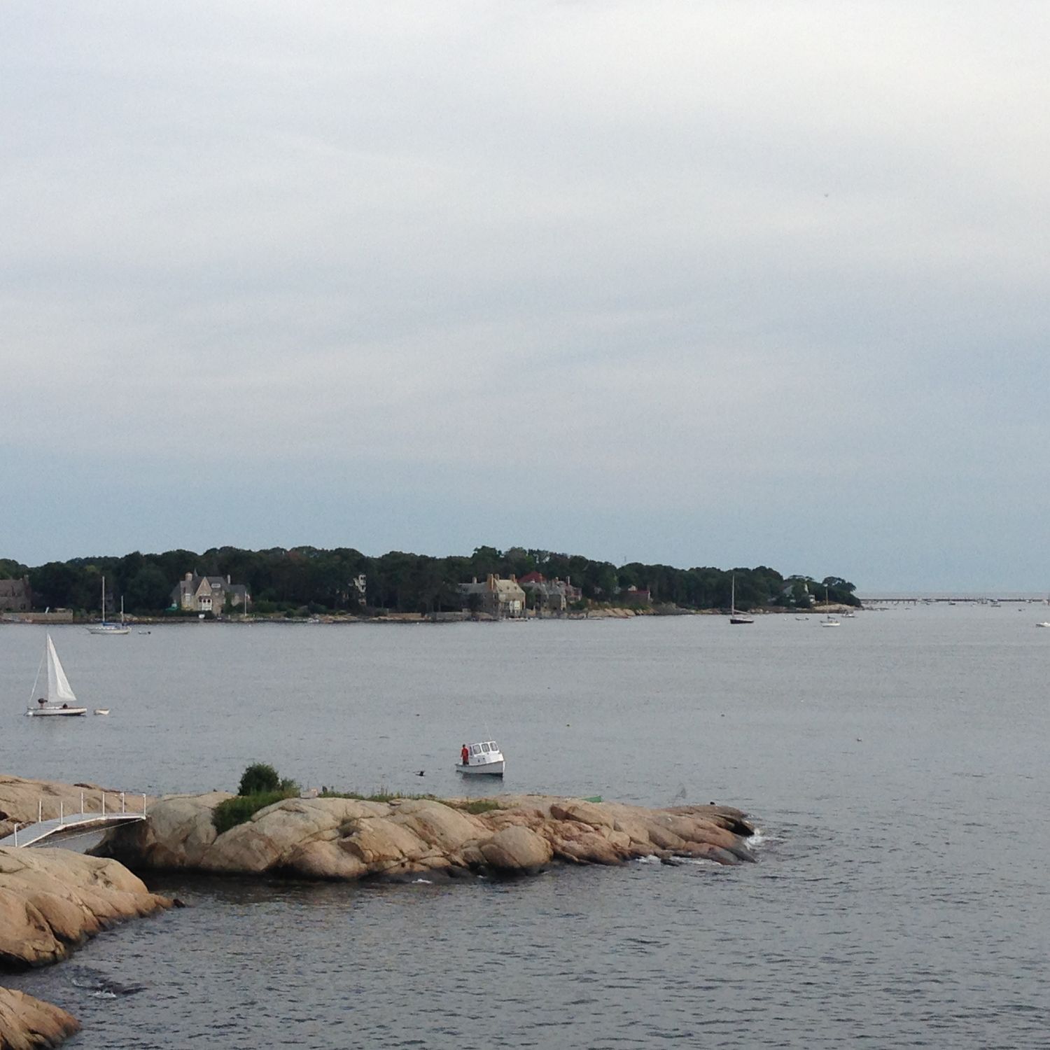 Coastal landscape and shoreline under cloudy sky. Used as a background for a painting project.
