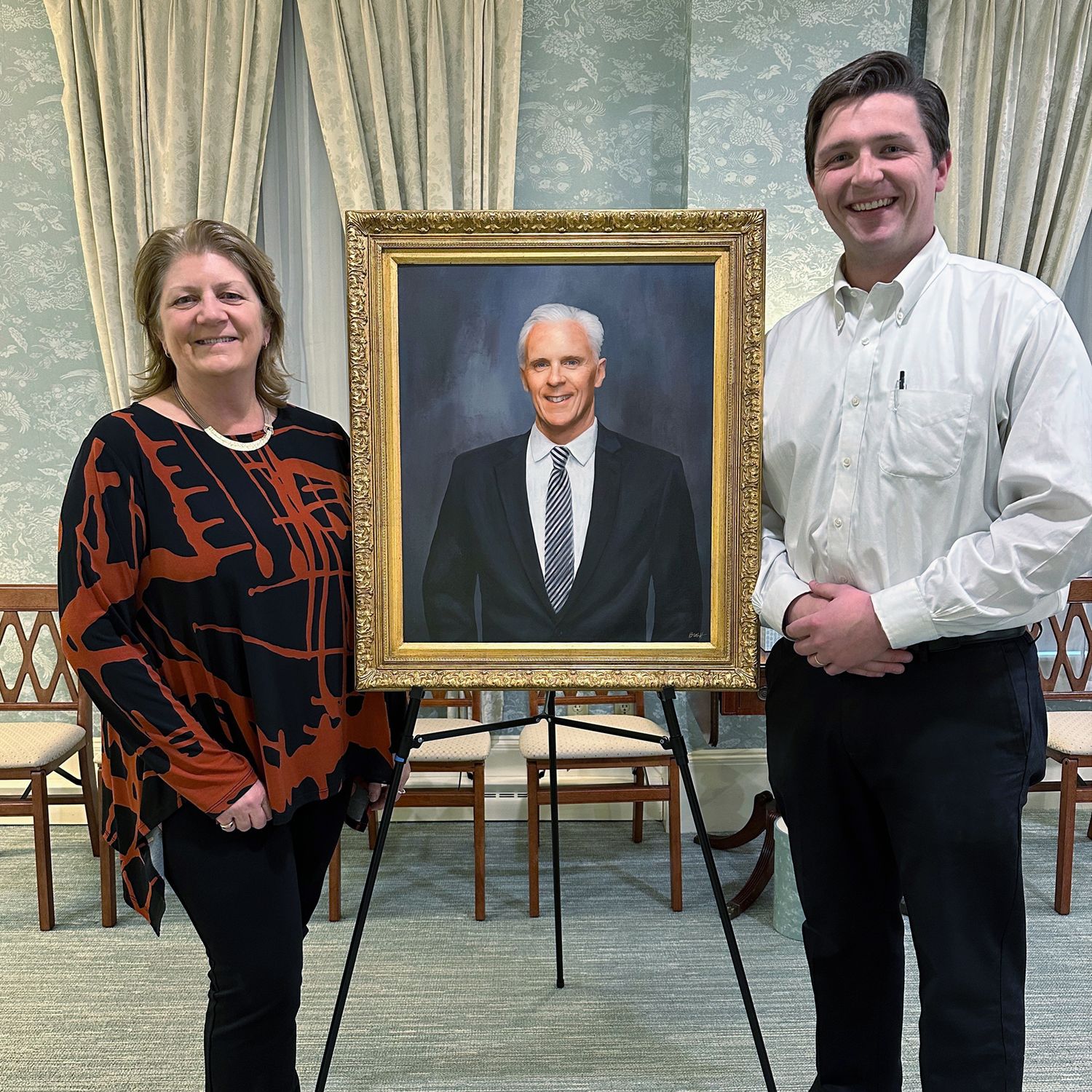 Unveiling the portrait of Frank Murphy at Murphy Funeral home with his son Francis.
