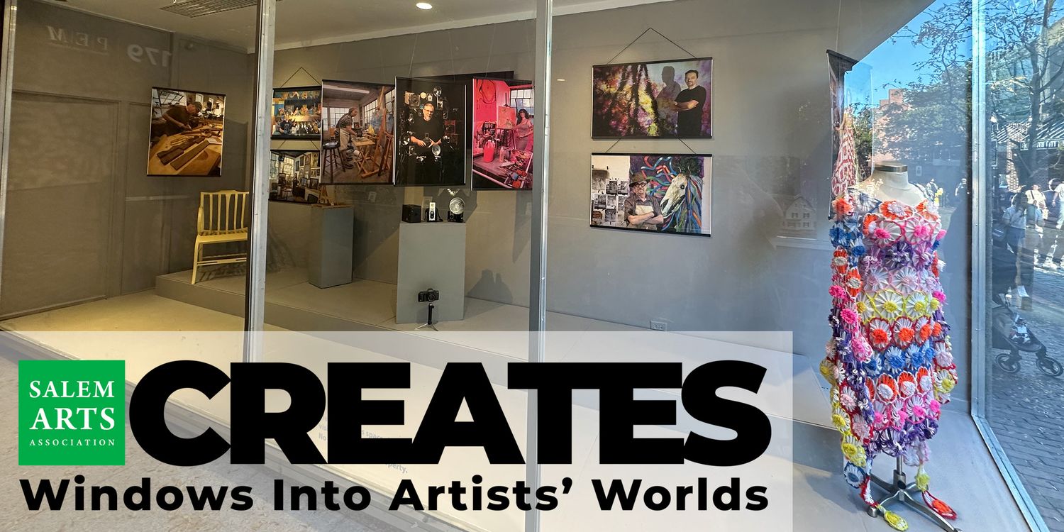 Portraits of Salem artists displayed in storefront windows near Peabody Essex Museum.