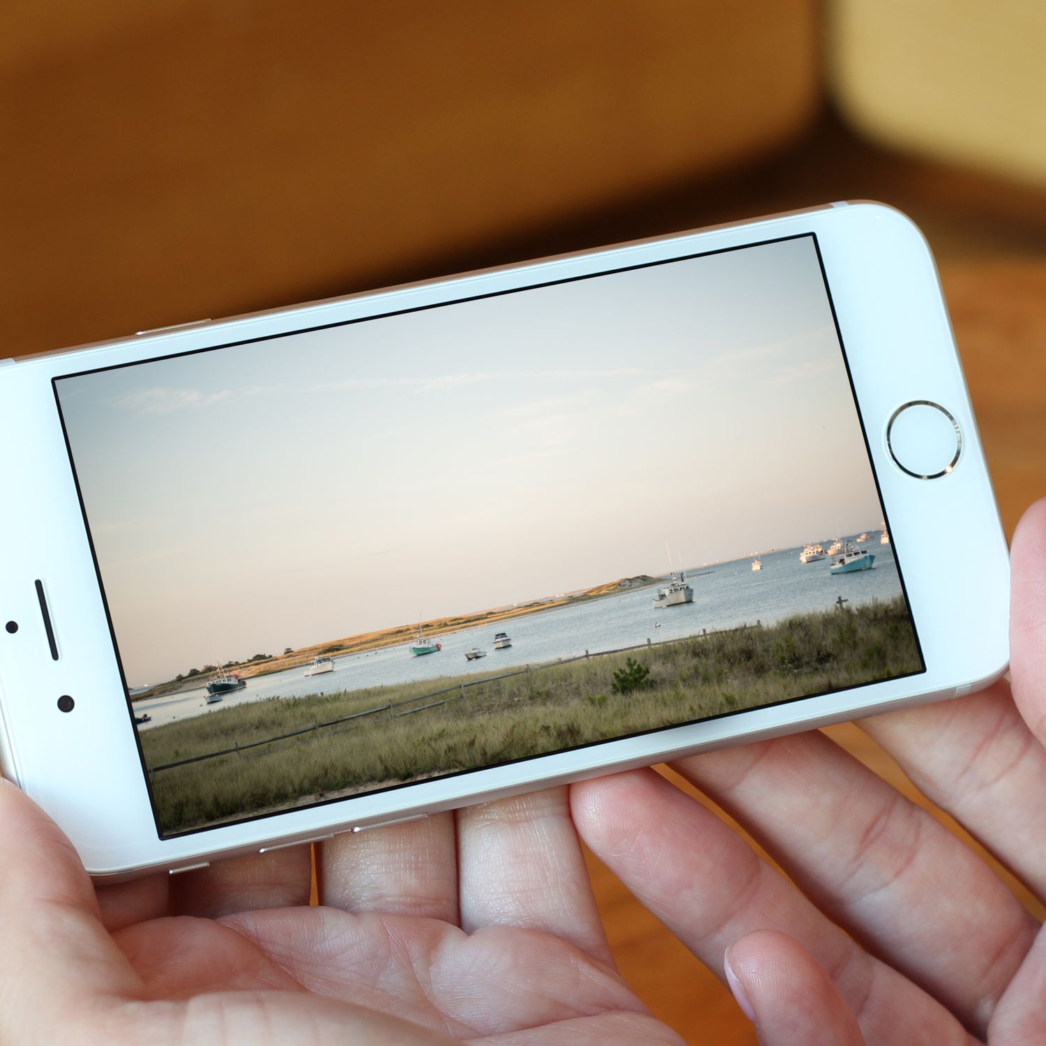 iPhone displaying the source photo for a commission of a meaningful coastal harbor landscape.