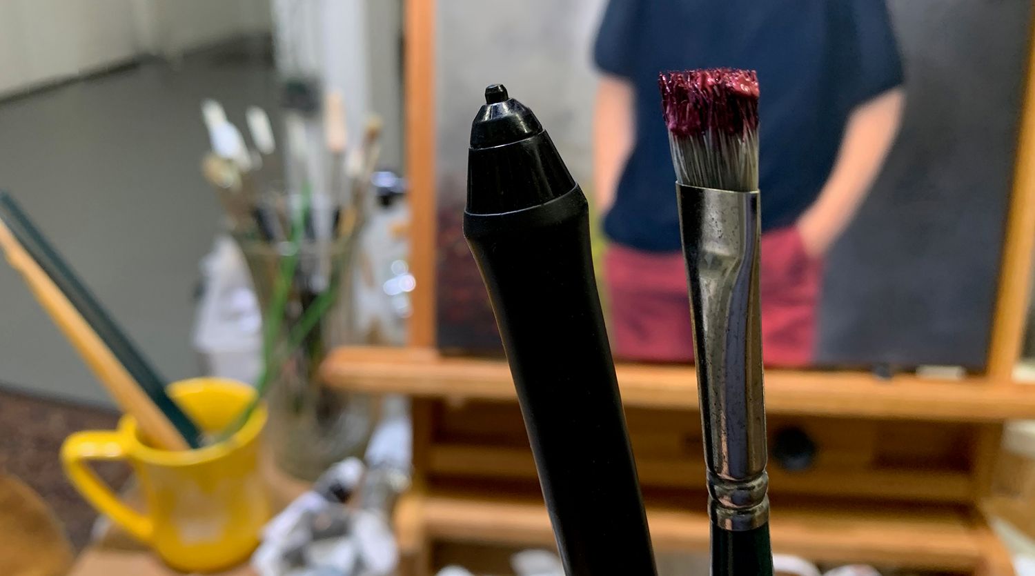 Tools of the trade in Bobbie Bush's studio: the electronic brush and the artists paint brush.