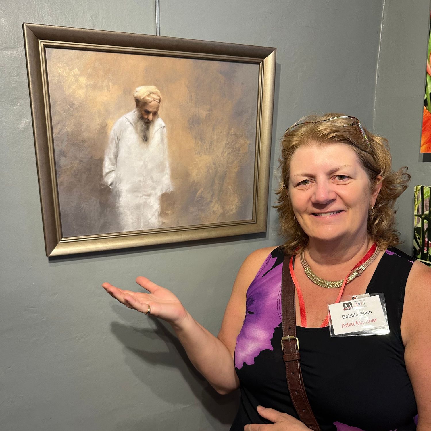 Bobbie Bush at Marblehead Arts Association in front of her recent painting