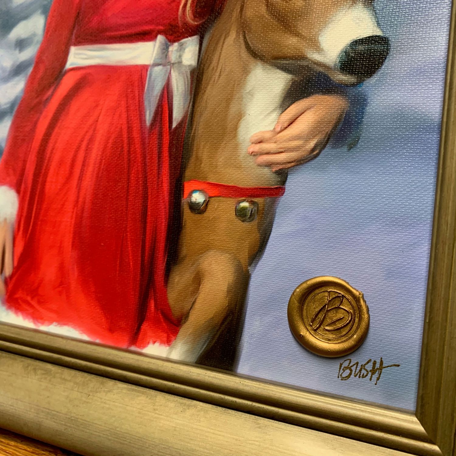 Detail of a painted artwork showing a bright red dress and reindeer with artist's signature seal.