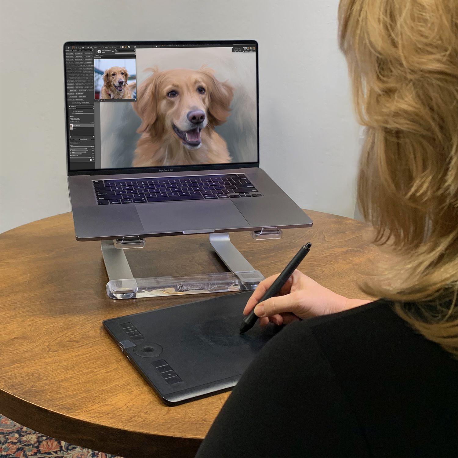 Artist Bobbie Bush using a painting software and electronic tablet to render a dog portrait painting.