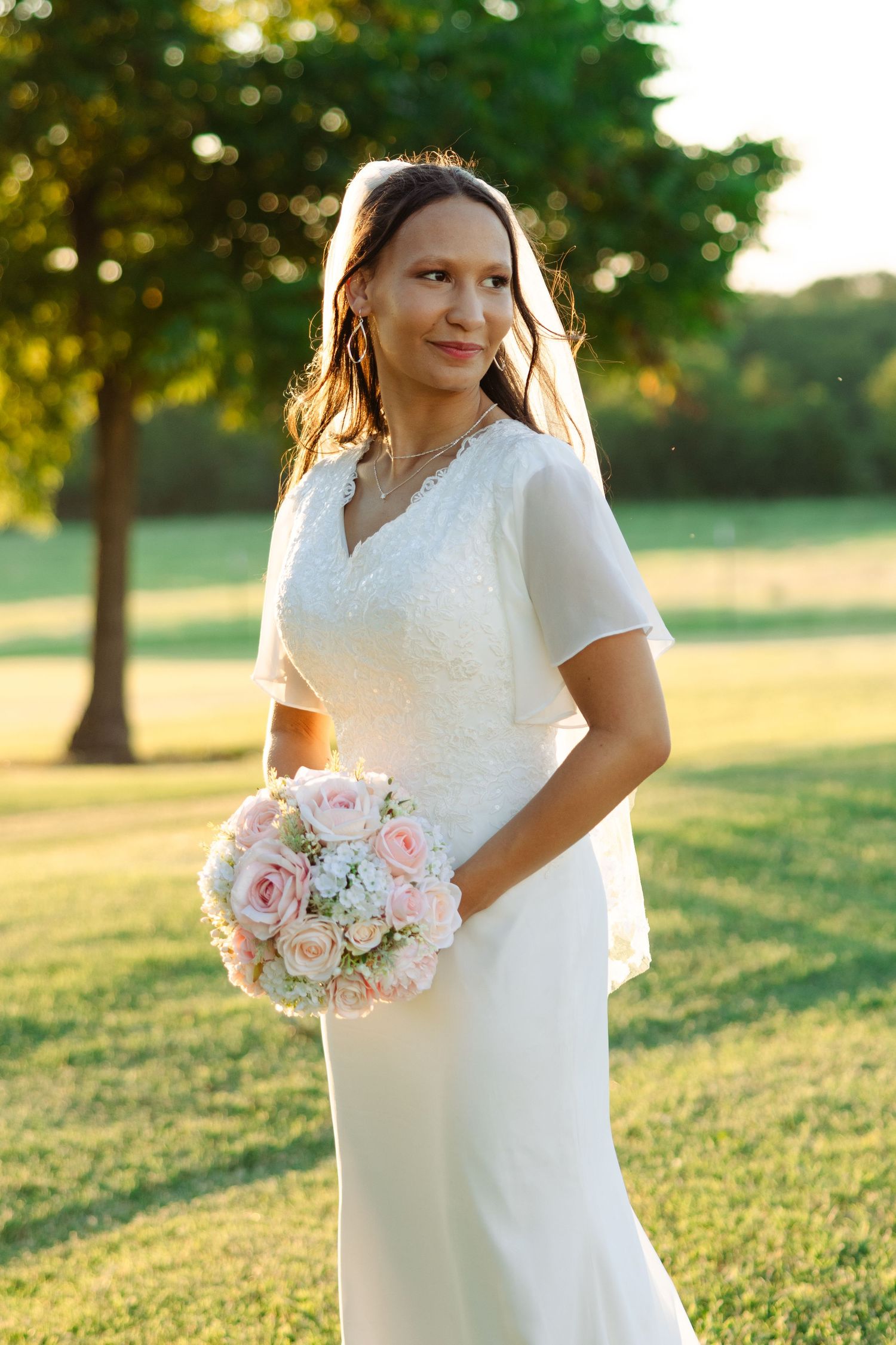 A bride poses for a photo on her wedding day in Texas.