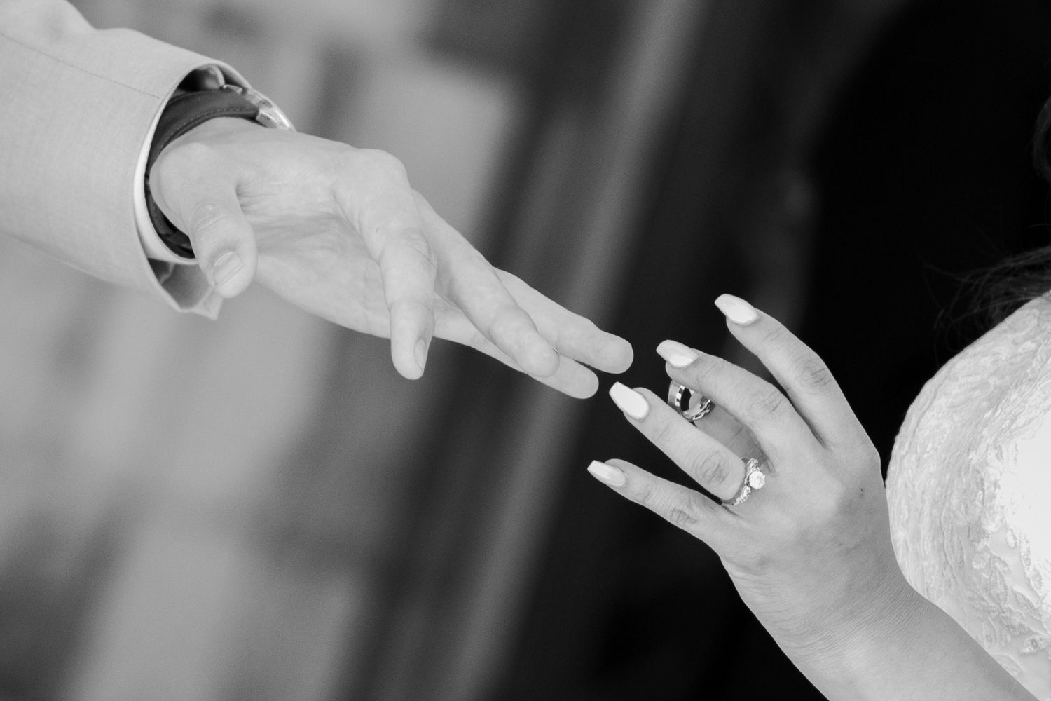 A bride places a ring on her groom's finger on their wedding day in Texas.