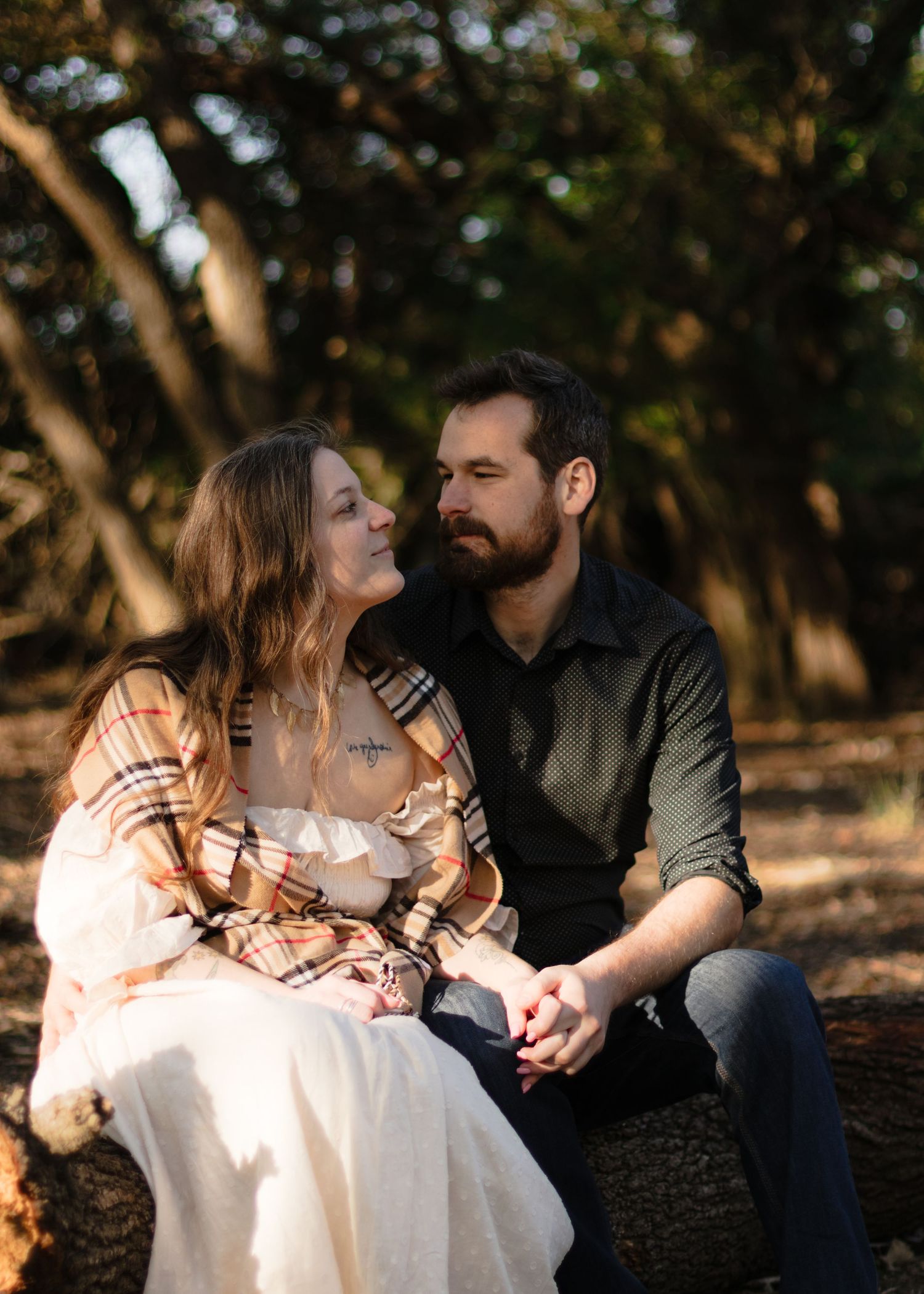 A couple looks at each other lovingly at a park near Austin, Texas.