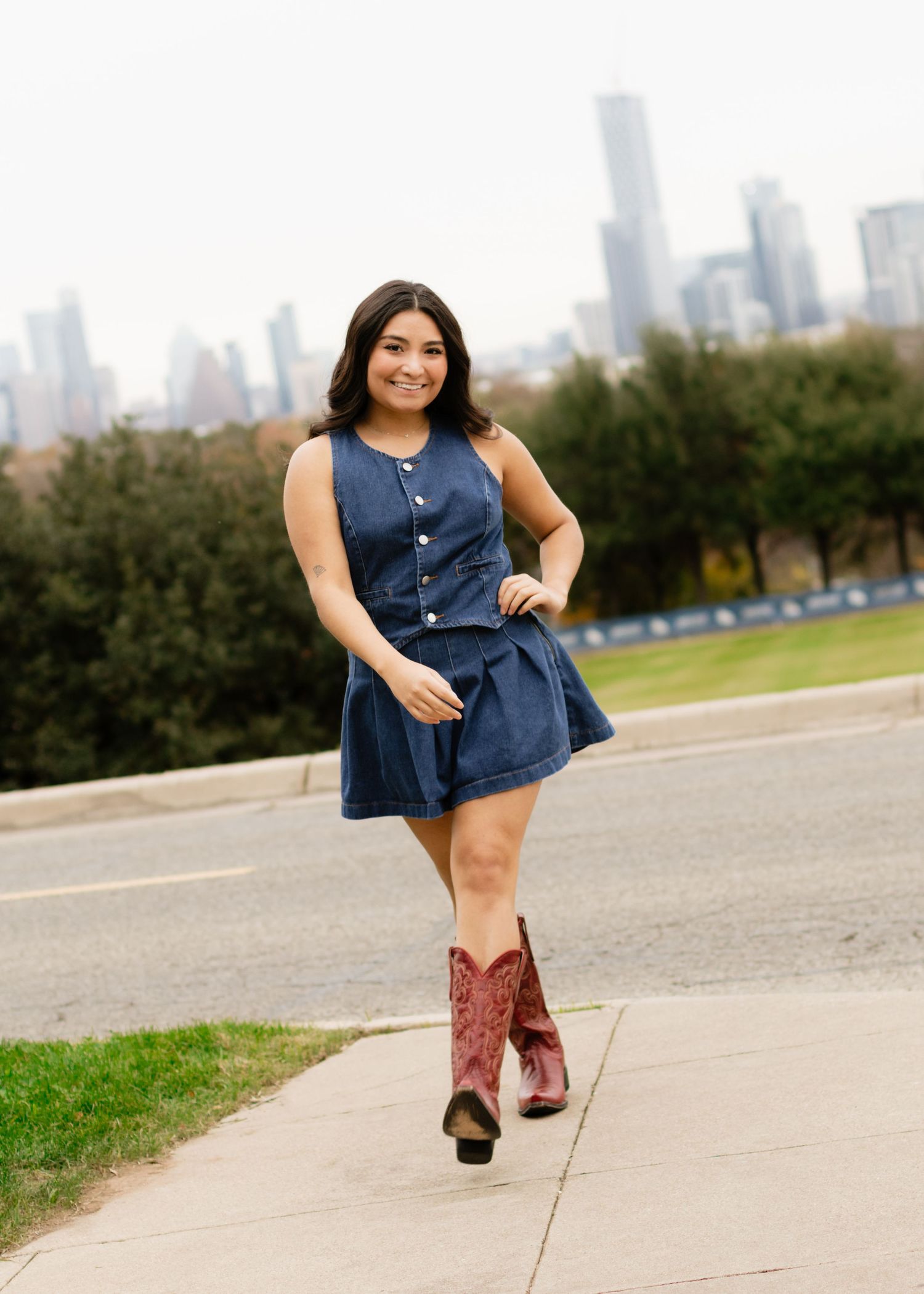 A graduating senior walks on campus at St. Edward's University in Austin, Texas, during her senior portraits.