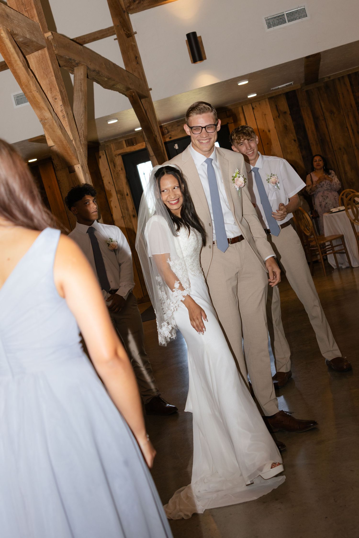 A bride and groom make a grand entrance to their wedding reception in Texas.