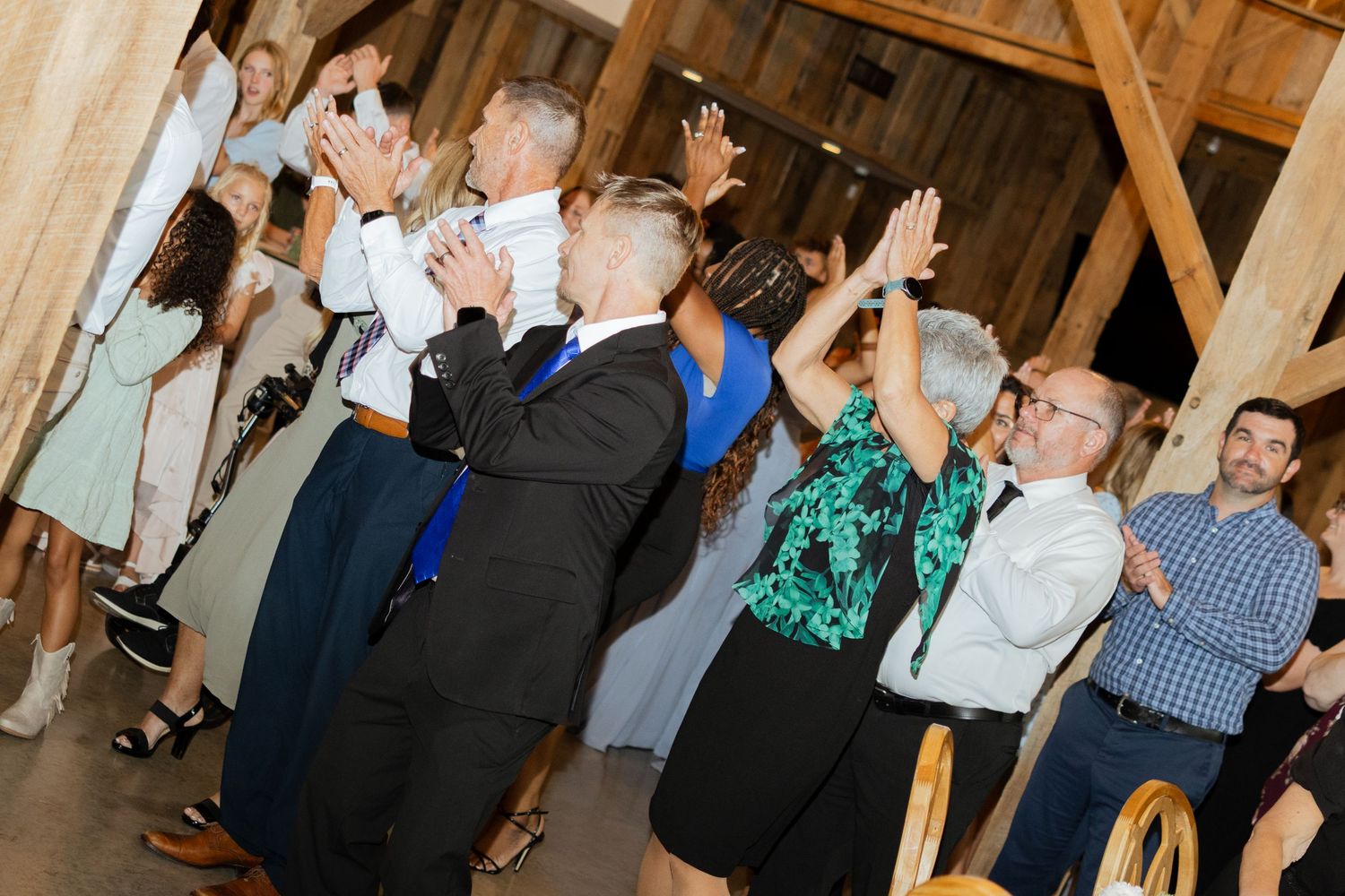 A group of people dances at a wedding reception in Texas.